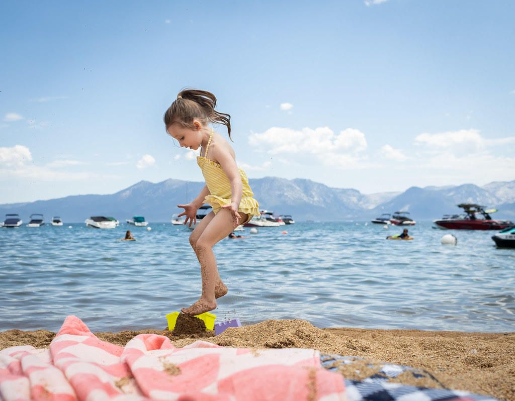 Young girl jumping on the beach