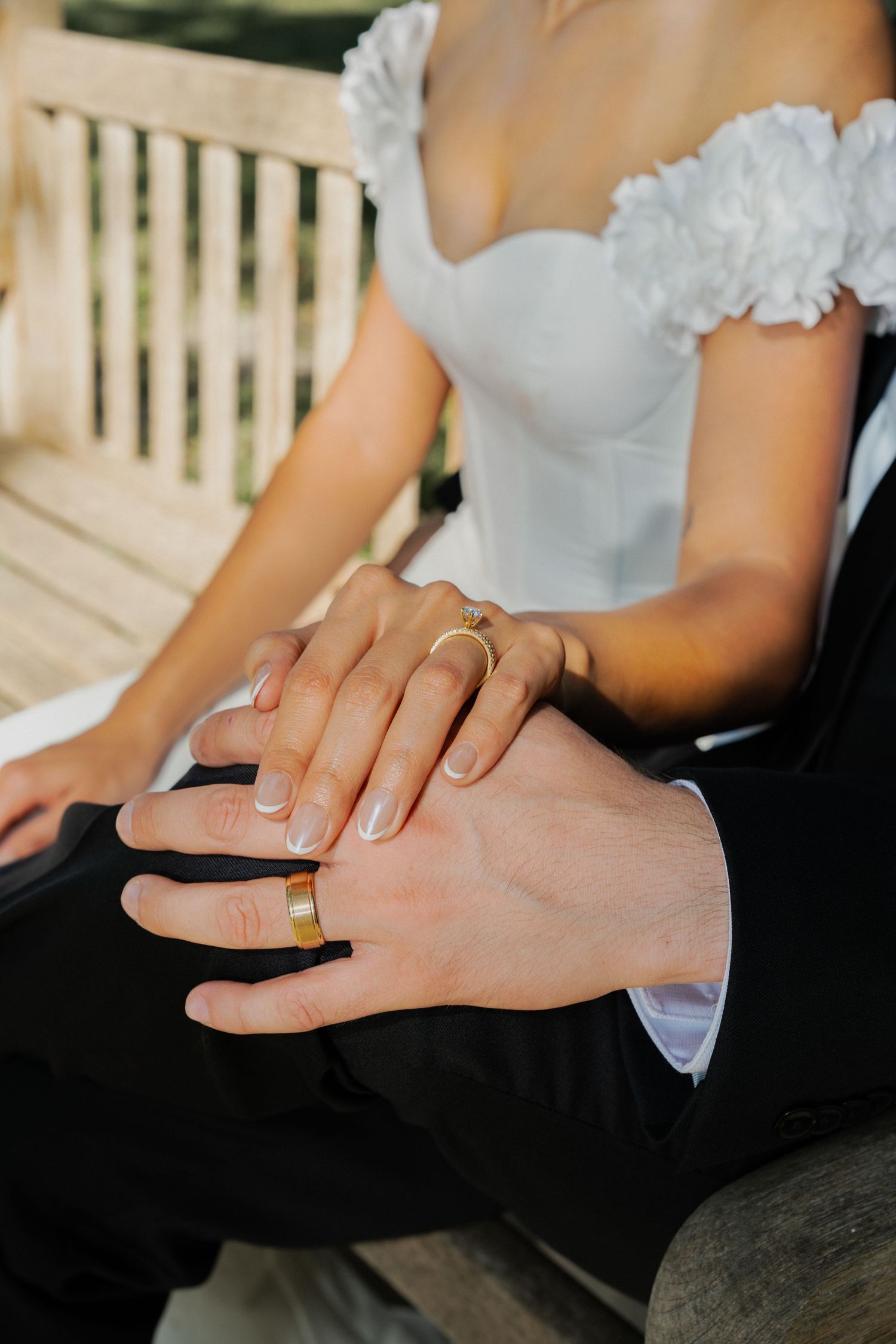 Close-up sequence showing hands gently massaging a foot in a spa setting against a dark background.