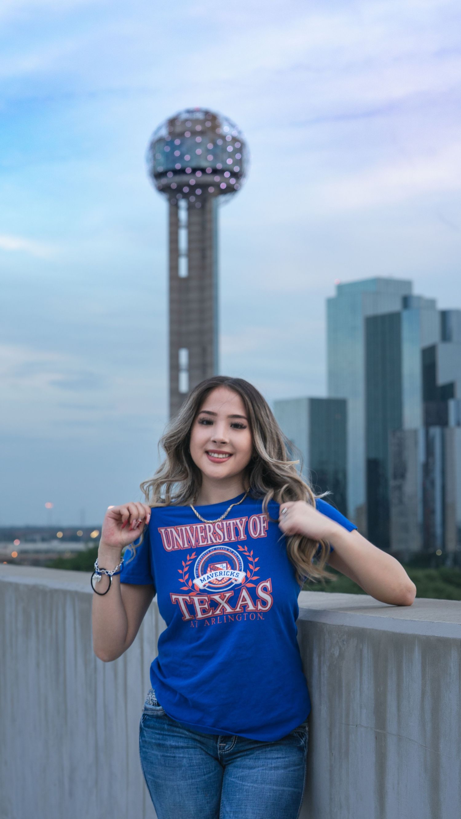 A series of photos showing someone posing against a city skyline wearing University of Texas apparel and blue jeans.