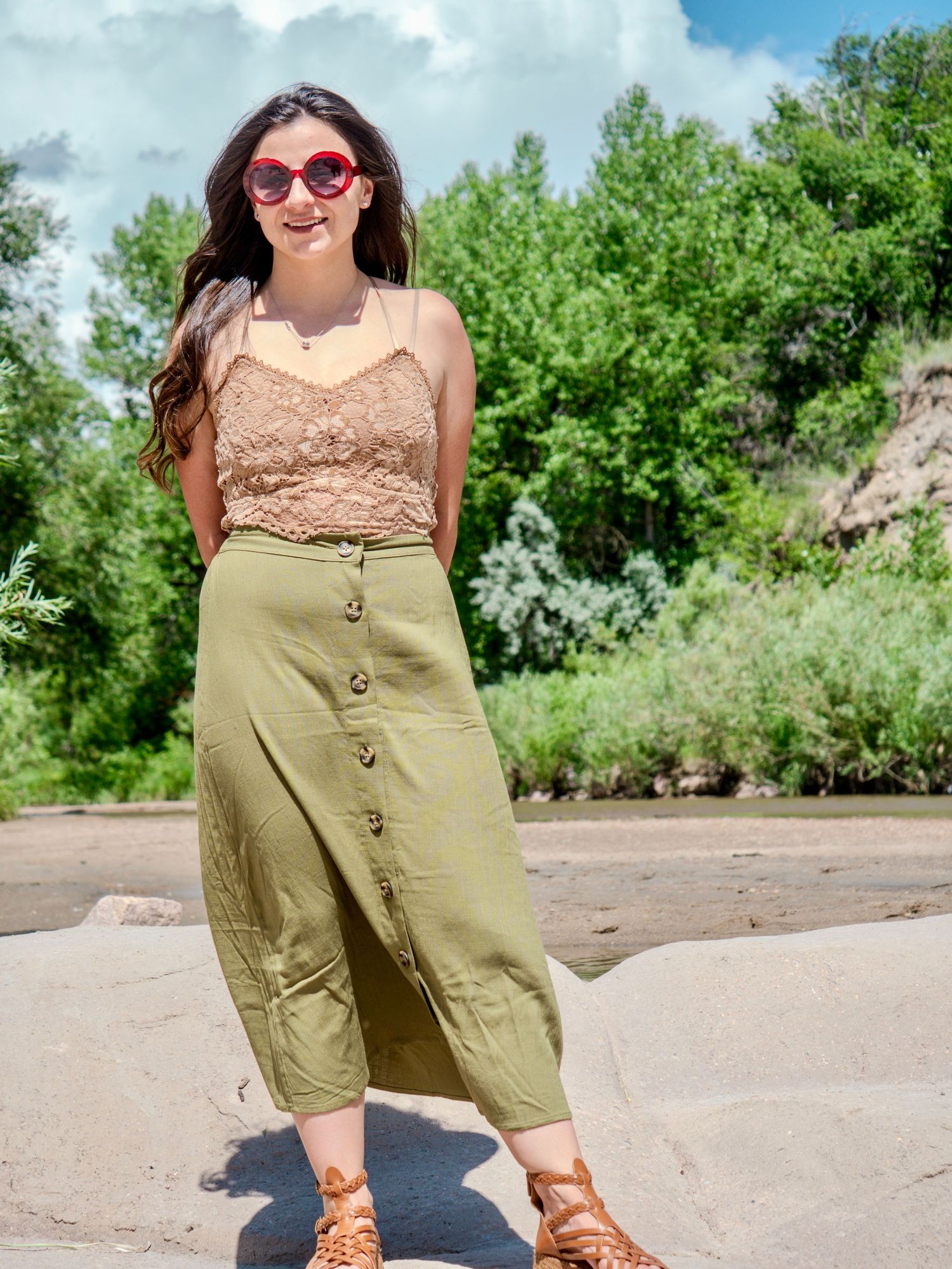 Collage showing someone modeling a beige lace top and olive green button-front shorts in an outdoor summer setting.