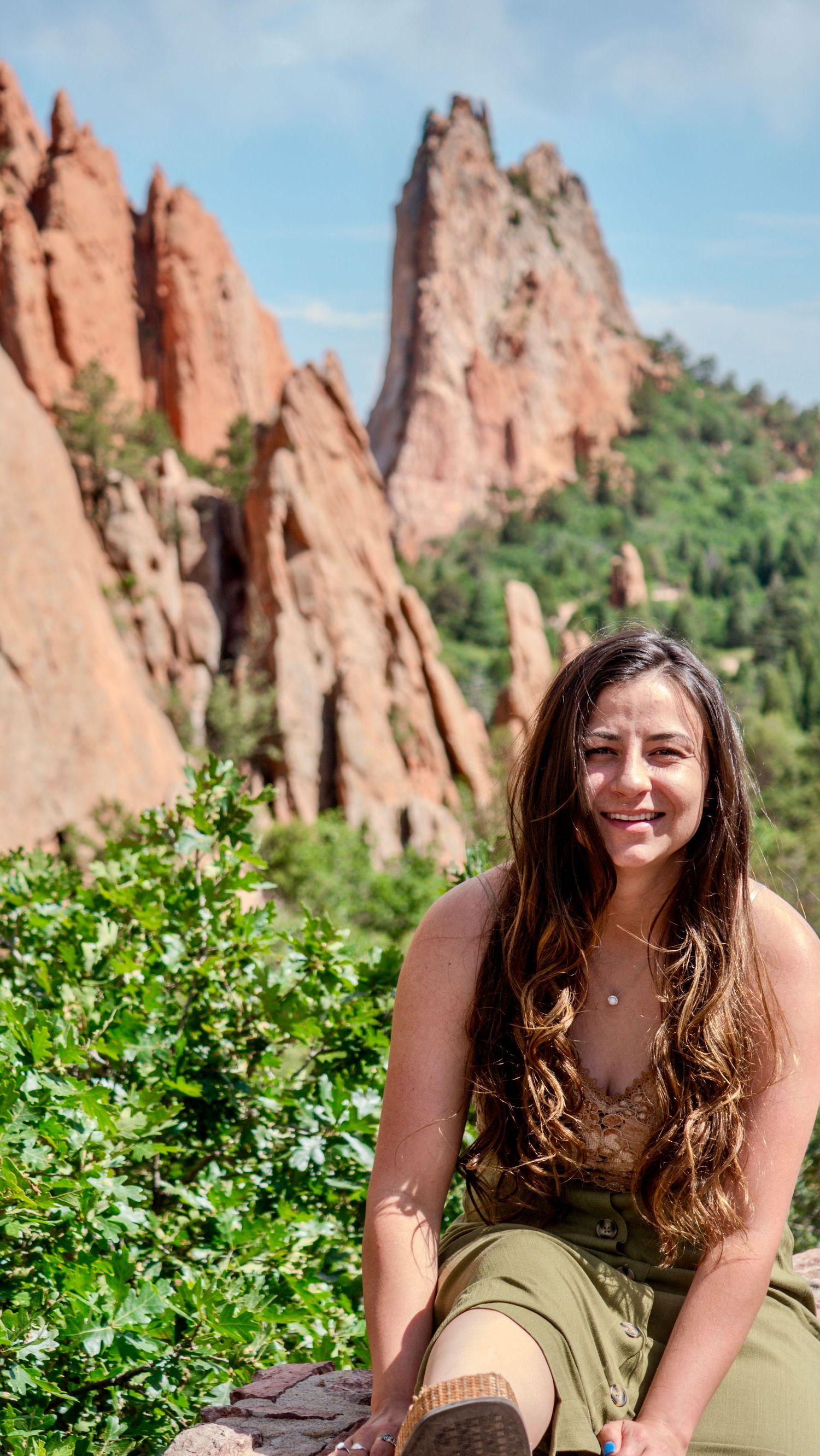 A series of photos showing a hiker enjoying scenic views of towering red rock formations at Garden of the Gods in Colorado.