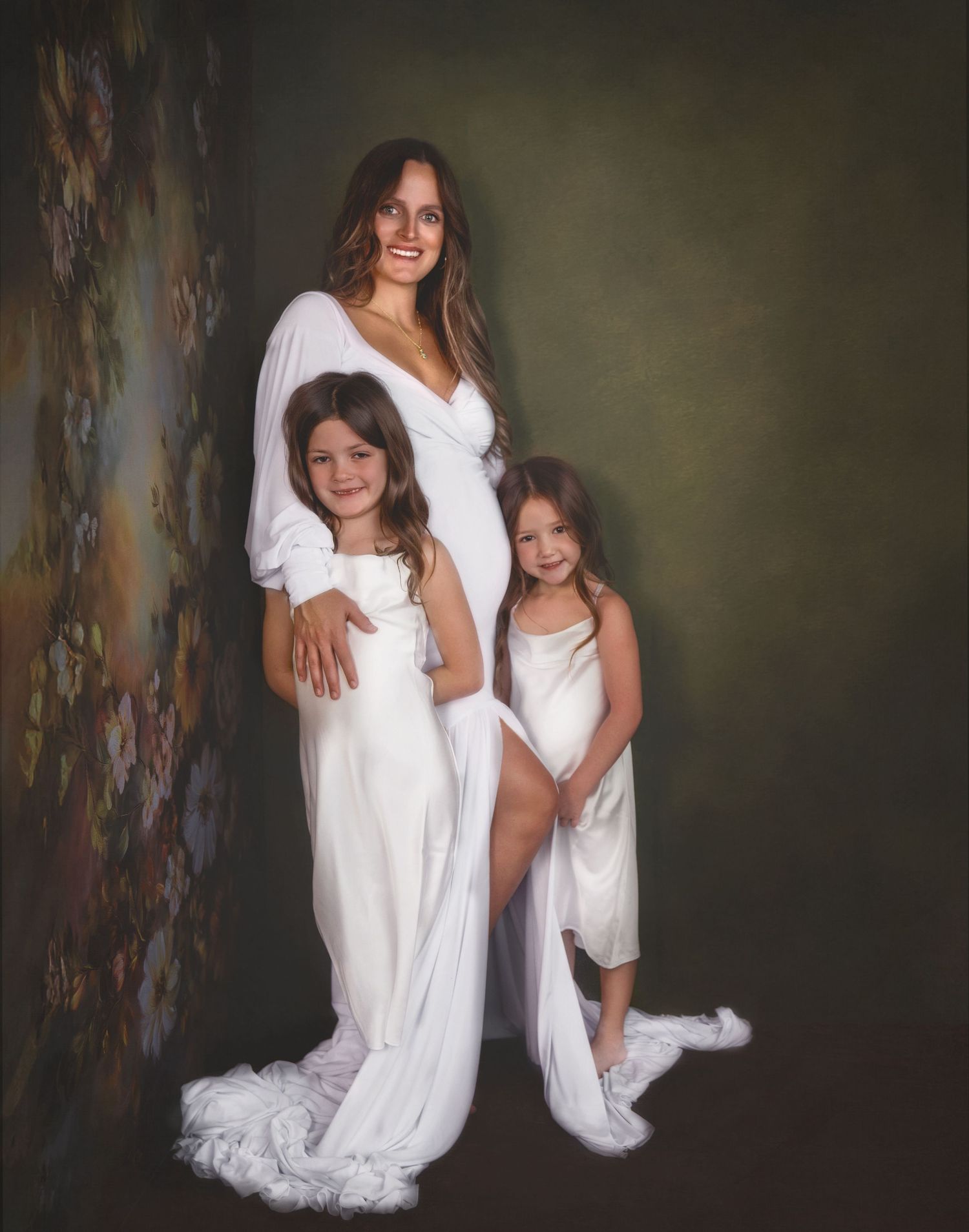 A series of artistic portrait photographs showing people in flowing white dresses against a dark textured backdrop.