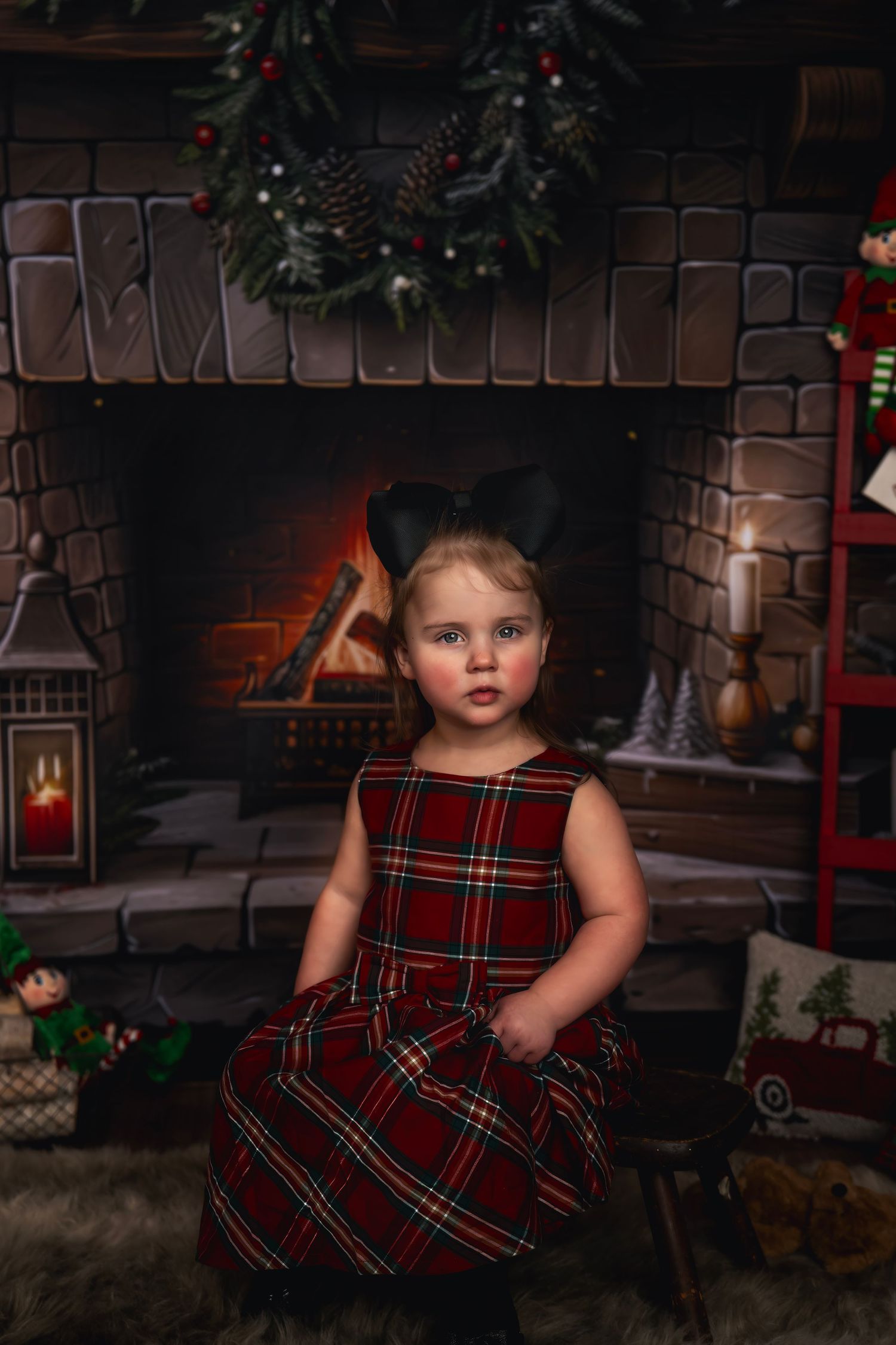 A festive Christmas scene with a cozy brick fireplace decorated with wreaths and stockings.