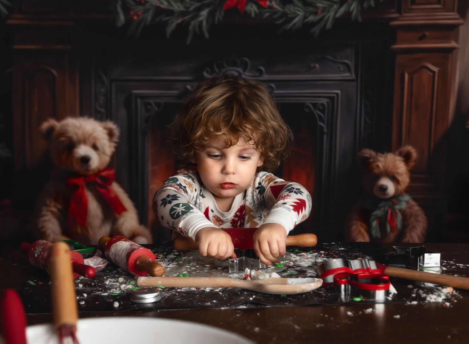 Christmas-themed photography session with cookies and baking props on dark wooden table.