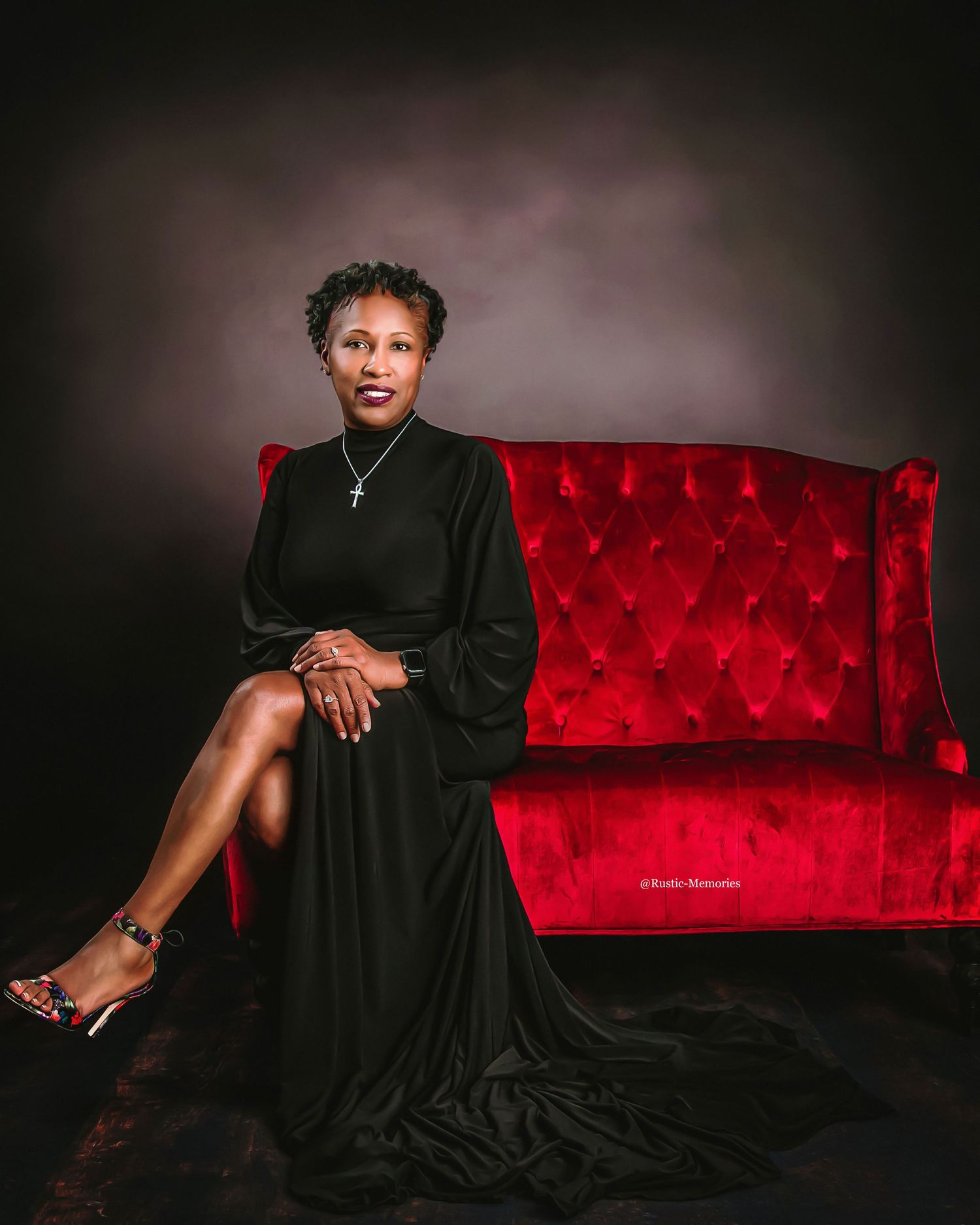 Glamour portraits featuring a black evening gown against a red velvet couch and dark background.