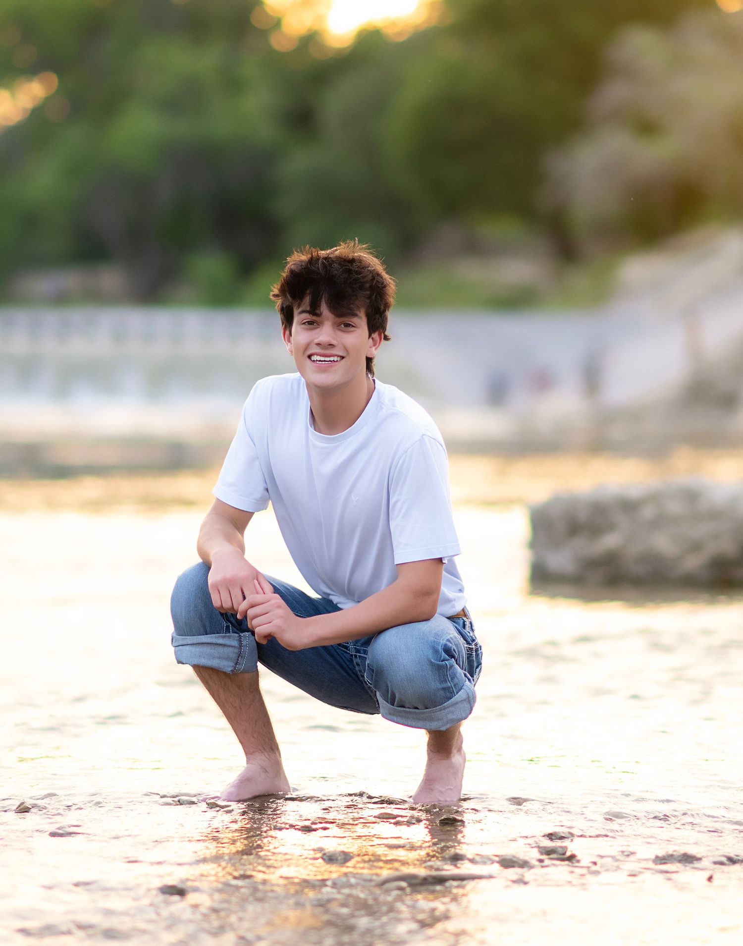 Summer beach portrait with golden sunset lighting.