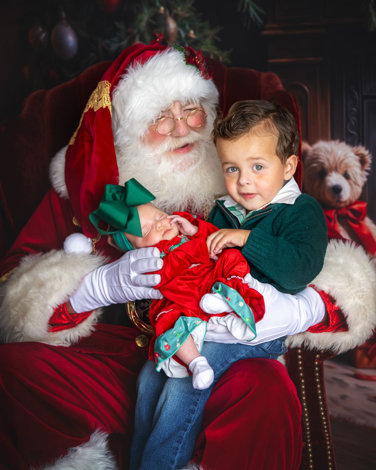 Holiday portraits with Santa Claus in traditional setting with festive decorations.