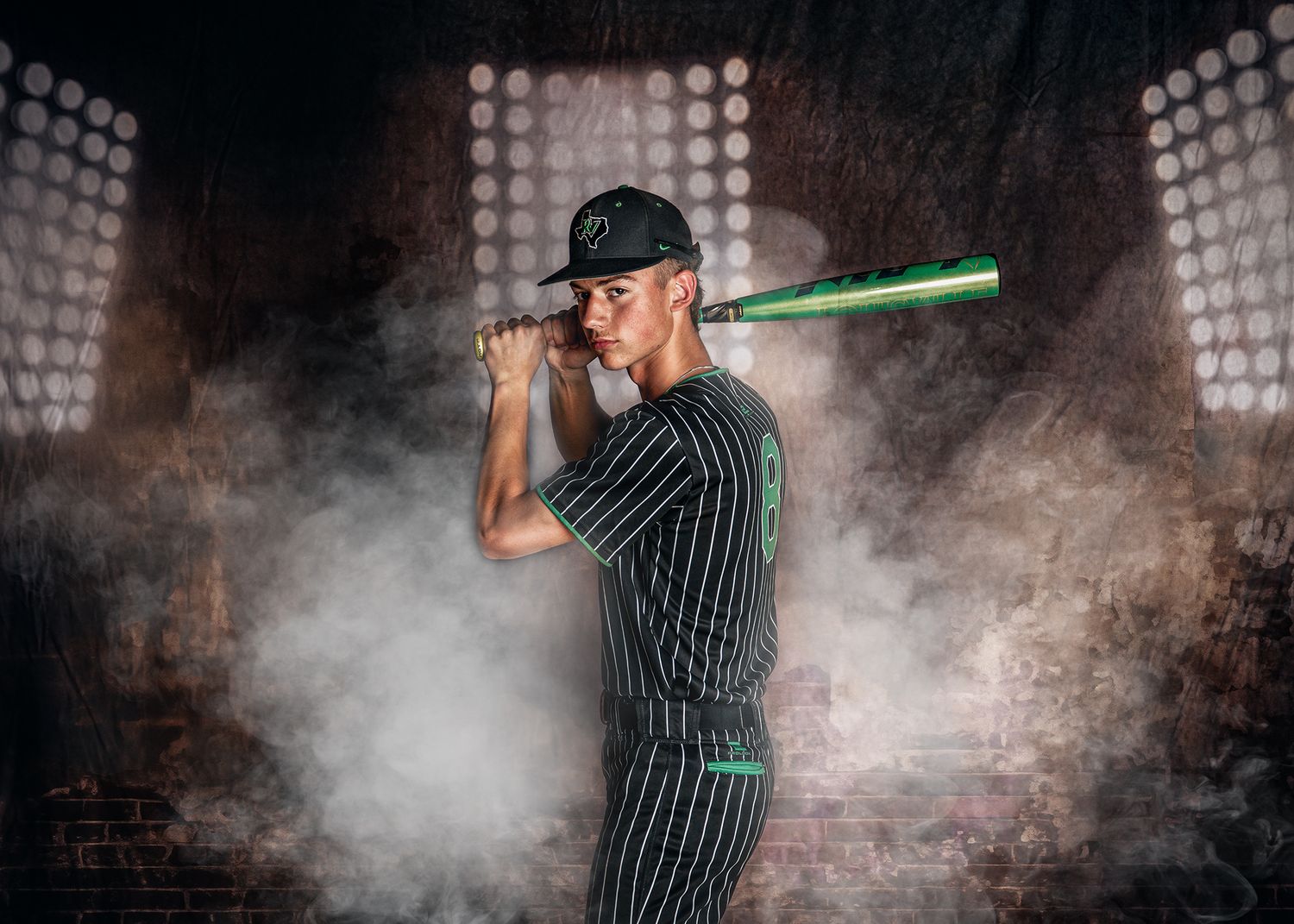 Dramatic portrait series of a person holding a baseball bat against a smoky dark background with spotlights.