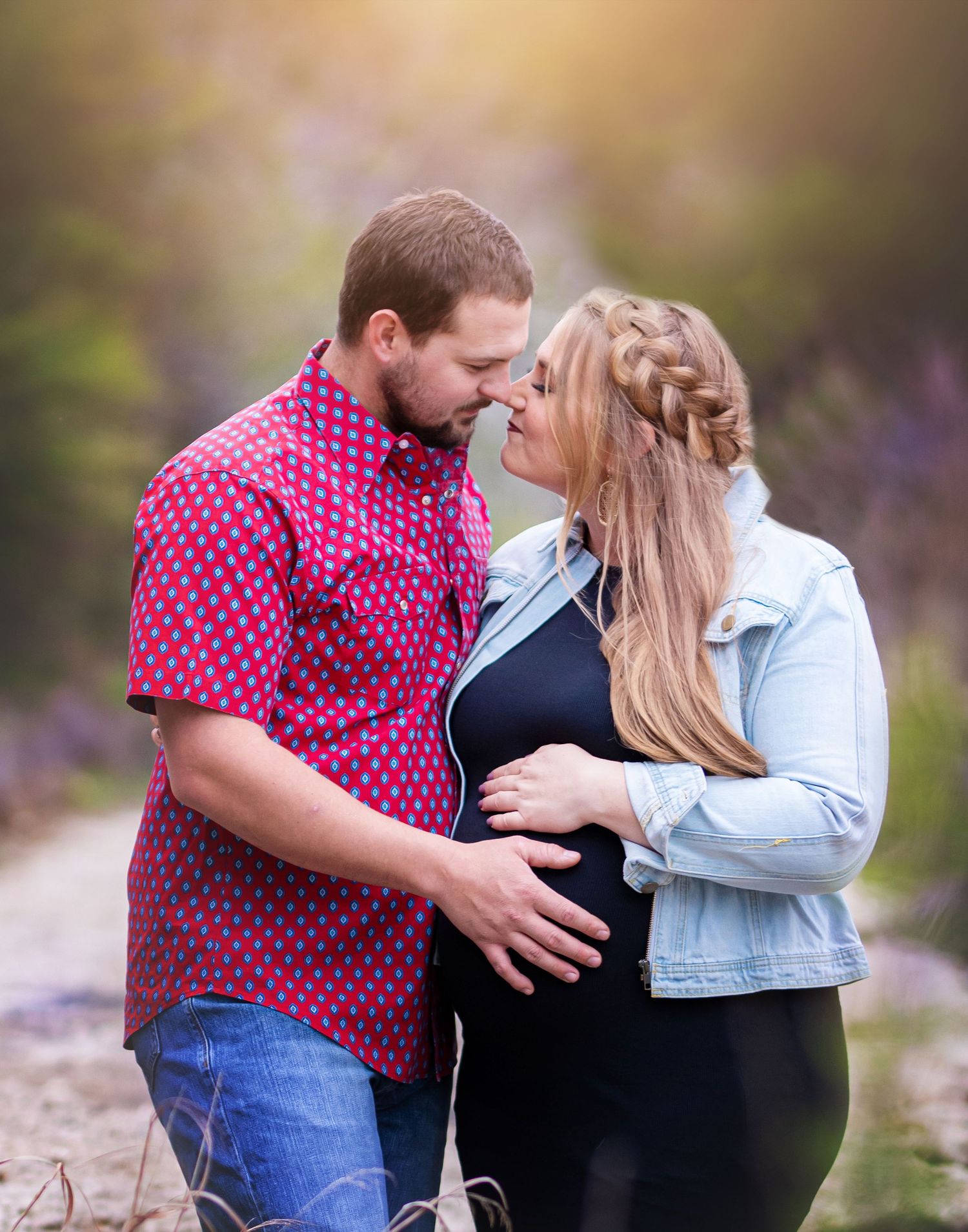 Intimate engagement photos of couple in pink and denim sharing tender moments.