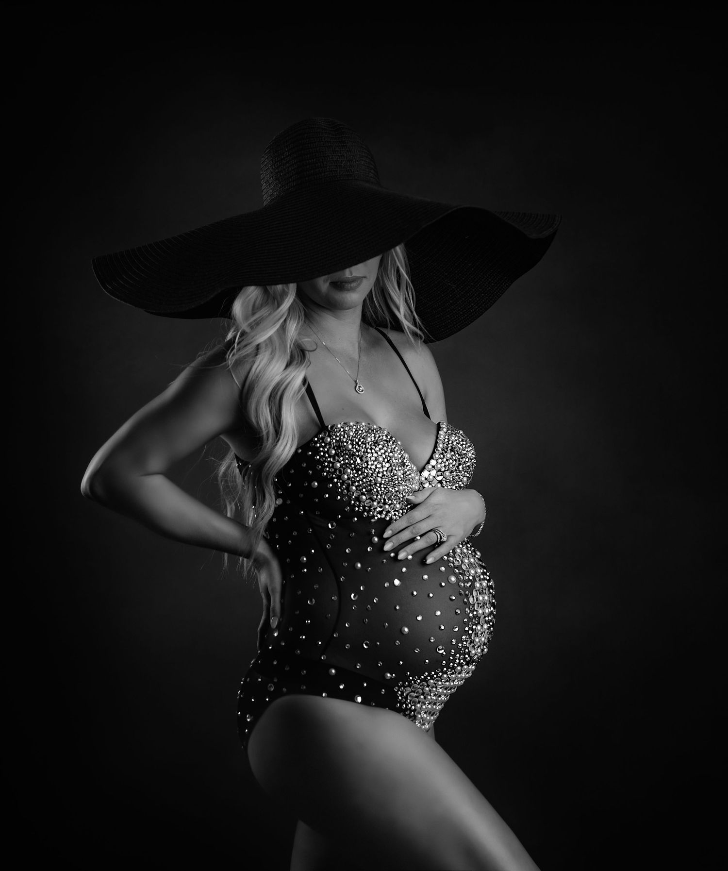 Dramatic black and white boudoir portraits featuring sparkly embellished bodice.