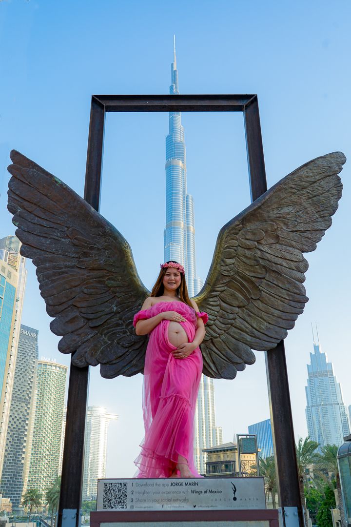 Maternity Photo on Burj Khalifa back Drop on a pink dress
