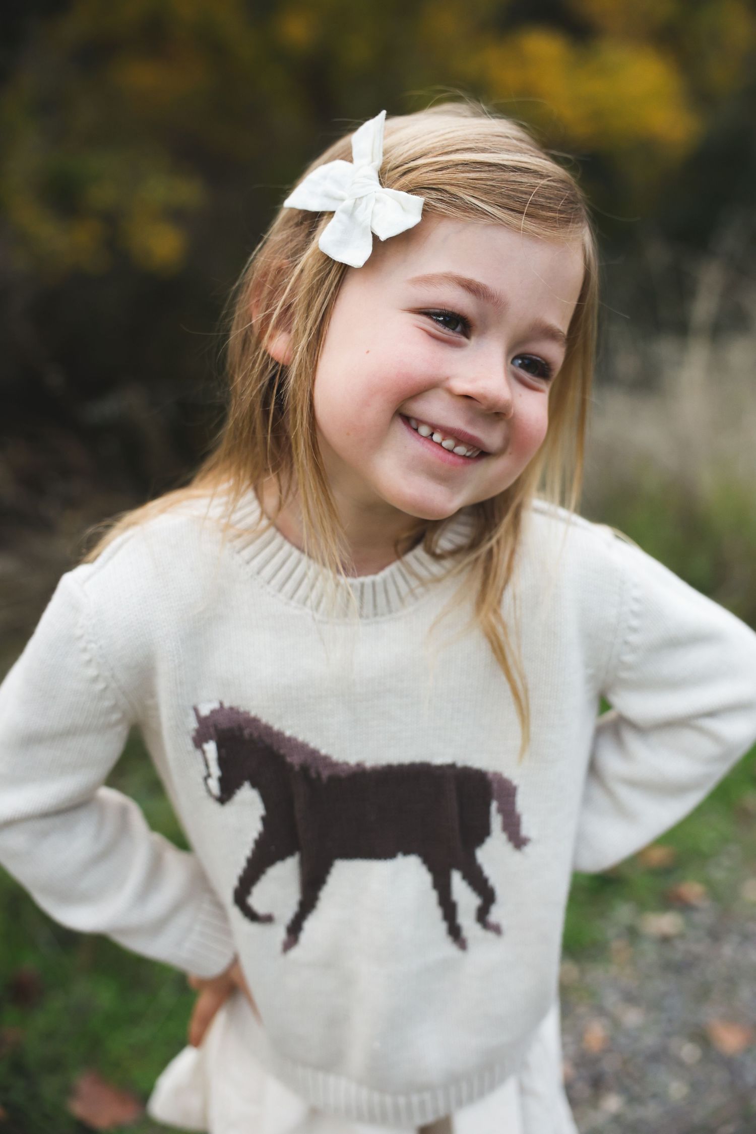 Close-up of a child smiling in golden hour light