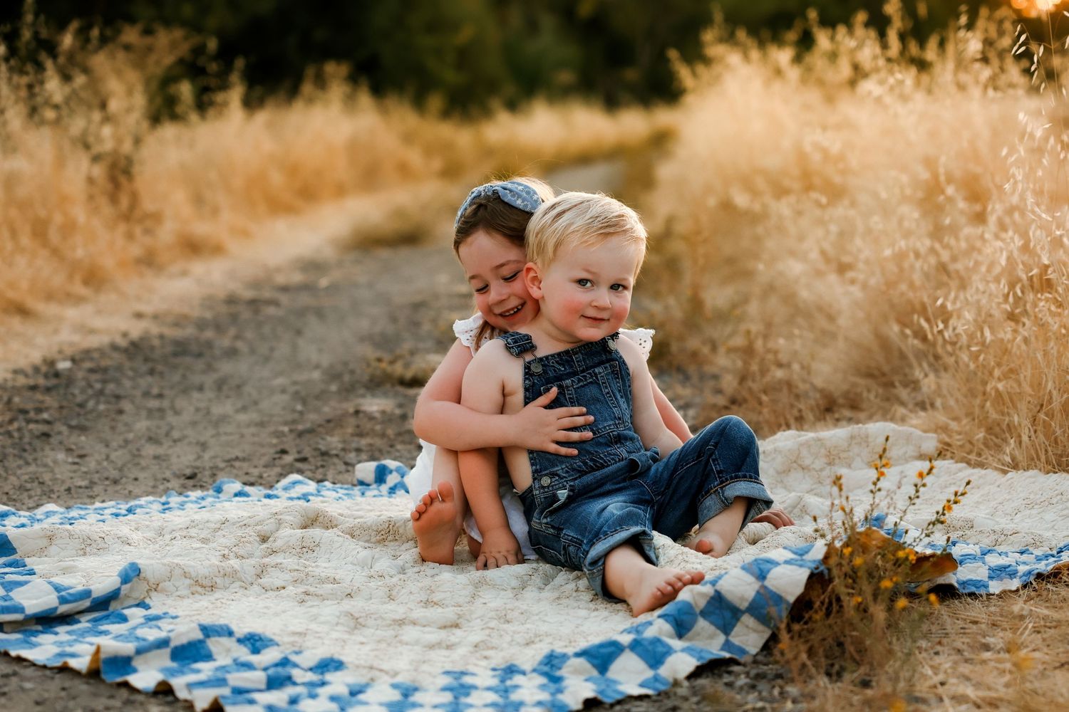 Children hugging during golden hour in Loomis, California