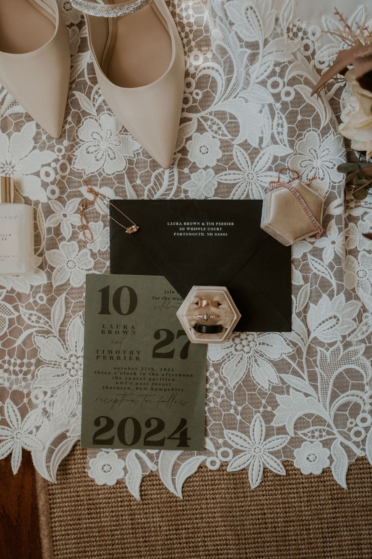 2024 wedding invitation suite displayed on white lace background with elegant typography.