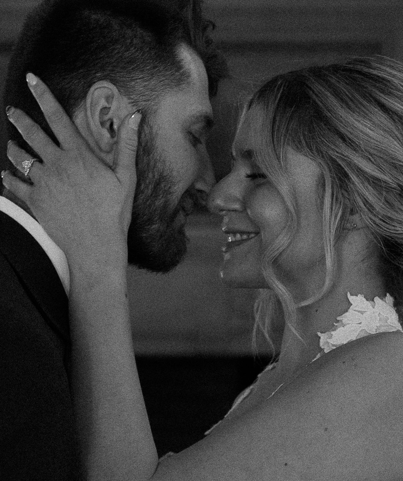 Intimate black and white portrait series showing tender romantic moments between a couple.