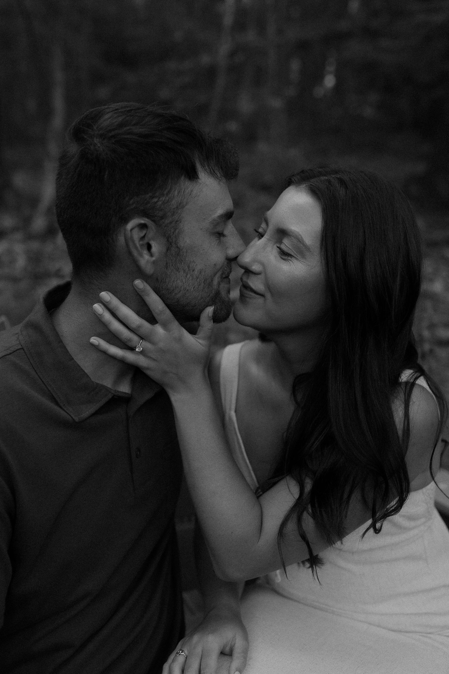 Intimate black and white photo series of a couple sharing romantic moments.