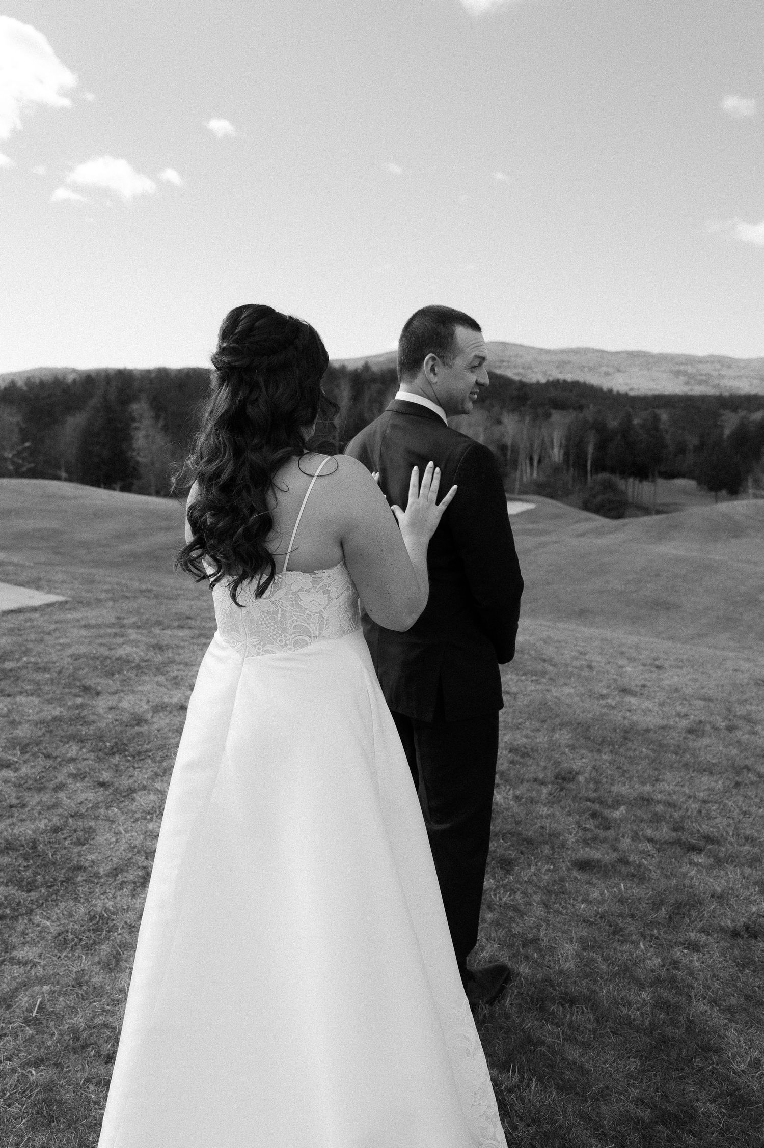 Black and white wedding photos capturing intimate moments in a scenic mountain landscape.