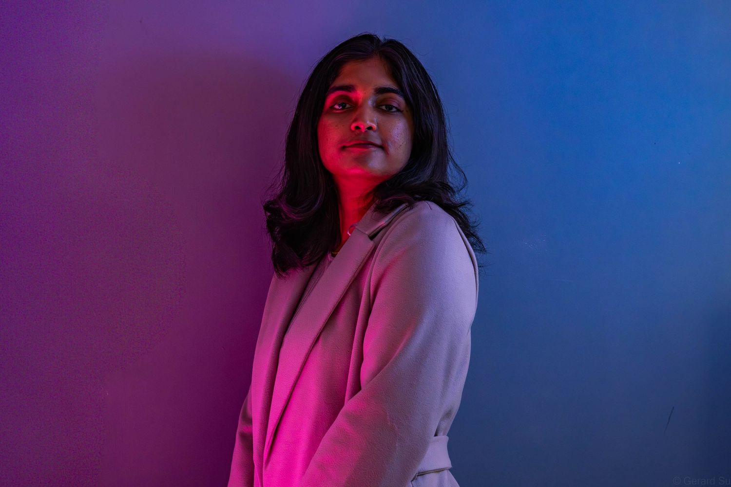 Professional creative female portrait photoshoot with dual coloured lights by Gerard Su Photography.