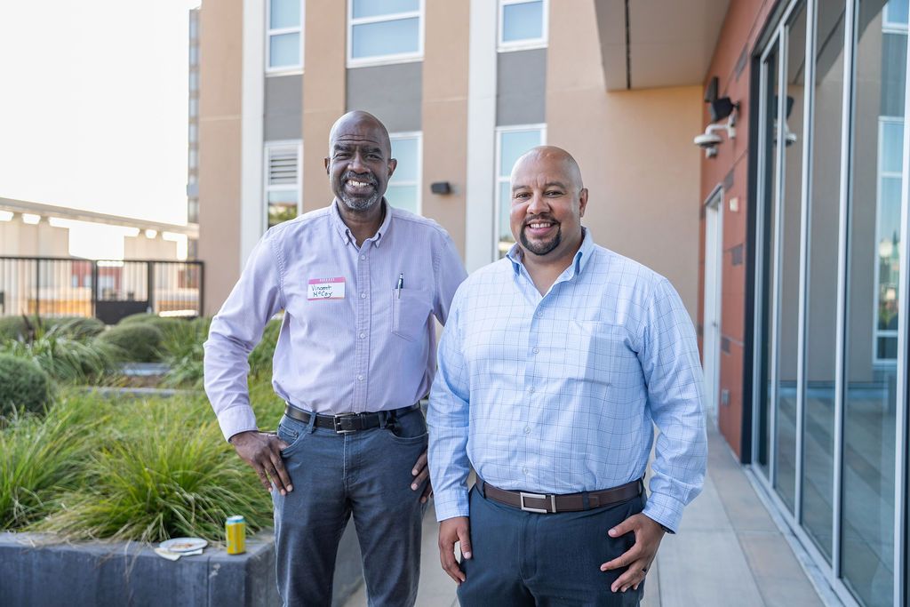 Two attendees pose together on the rooftop terrace at Residence Inn Berkeley during a Berkeley Chamber of Commerce networking event.