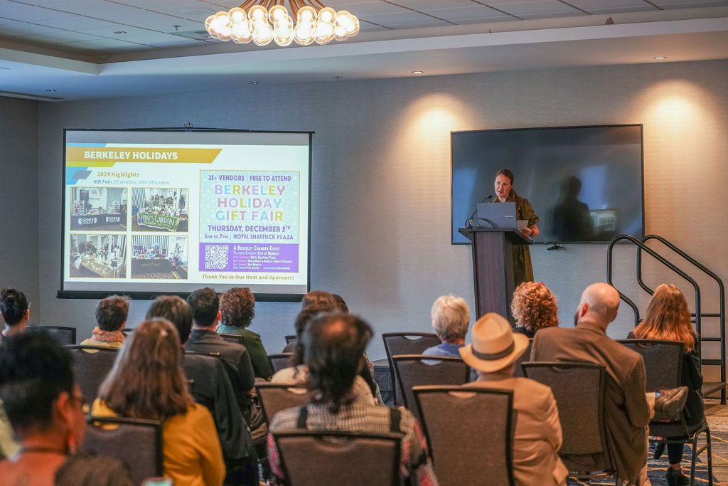A wide view of the ballroom as a speaker presents to a seated audience at the Berkeley Chamber of Commerce annual meeting.