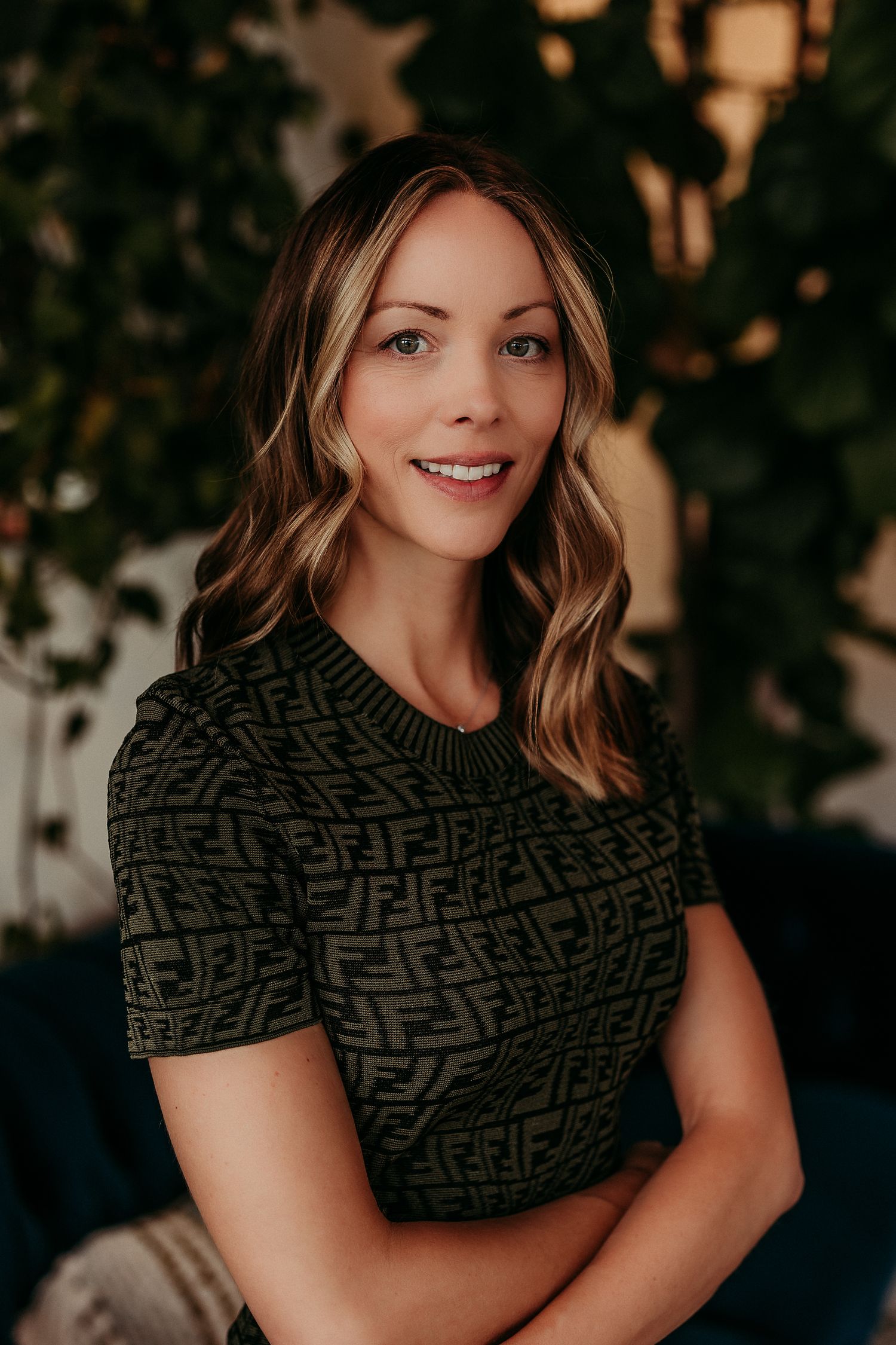 Portrait series featuring dark patterned top against evening outdoor backdrop.