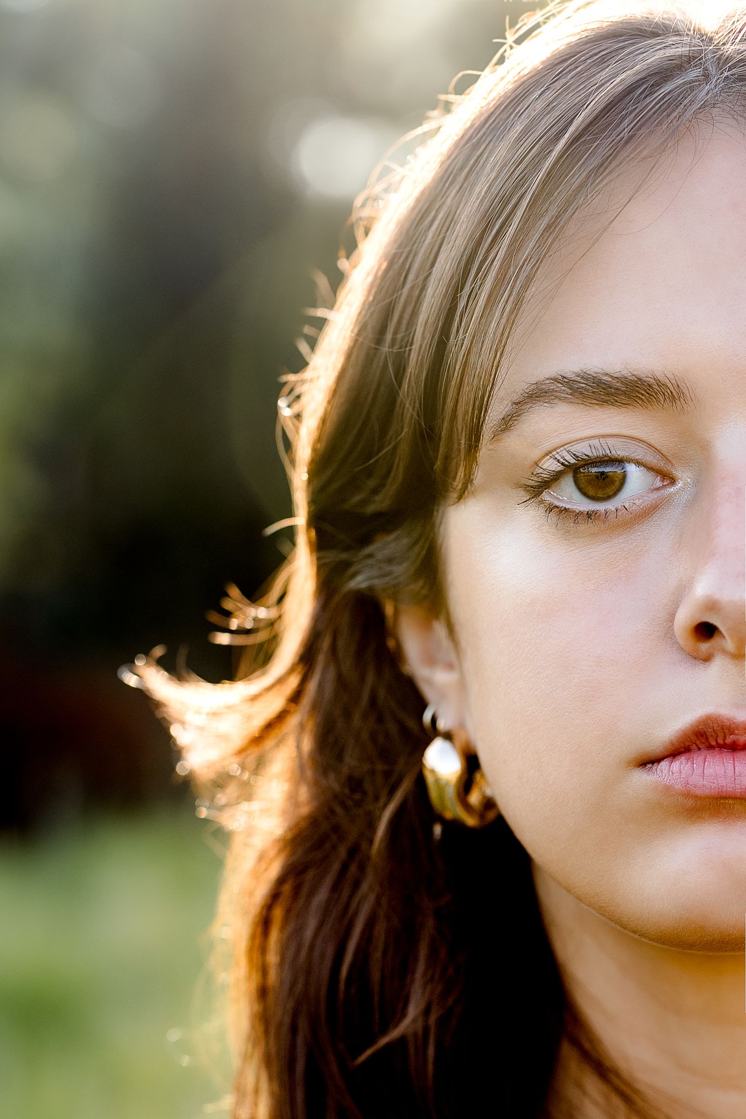 Close-up portrait series showing eyes and face in warm backlit natural lighting.