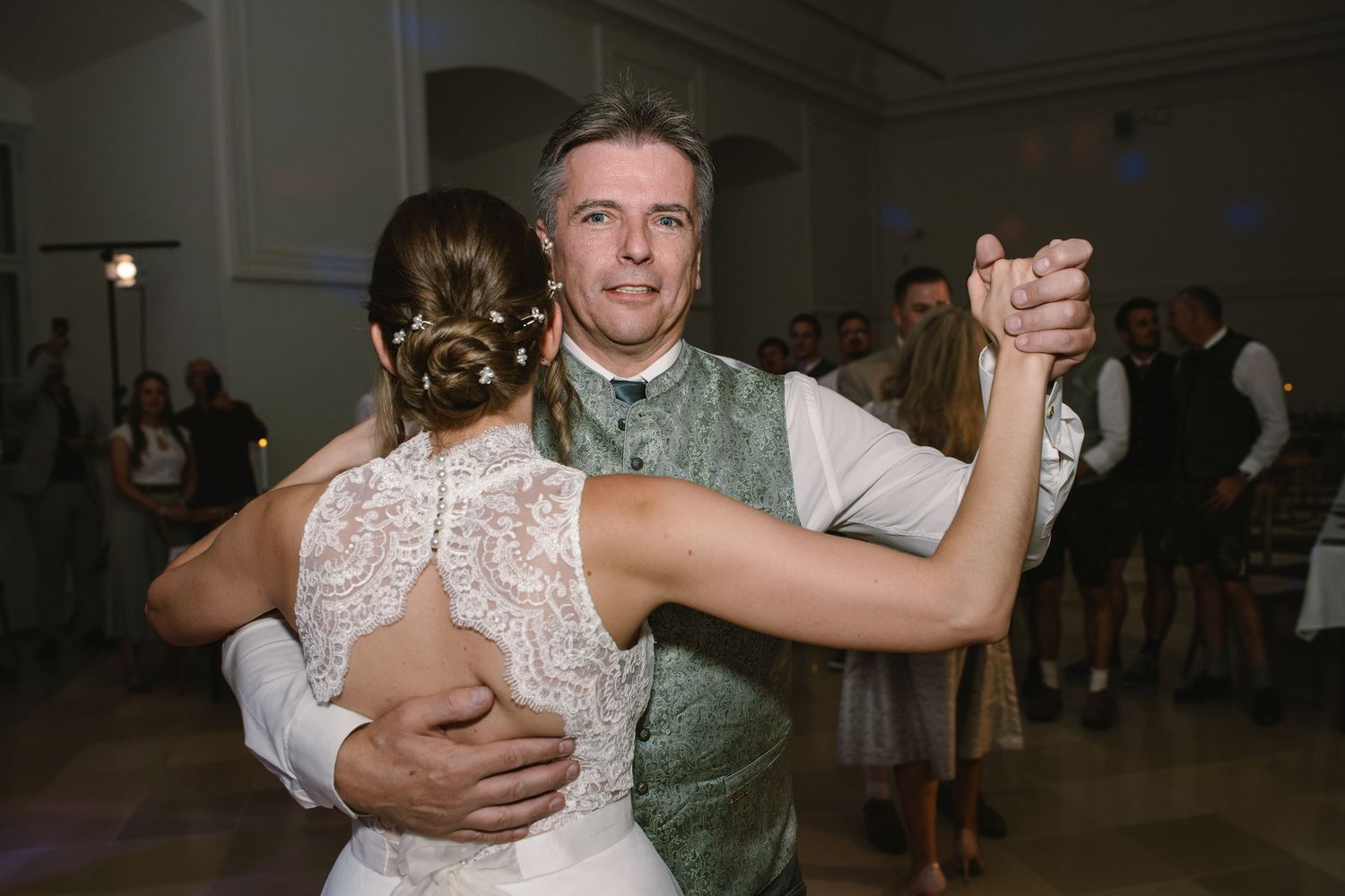 Couple performs an intimate slow dance during their wedding reception.