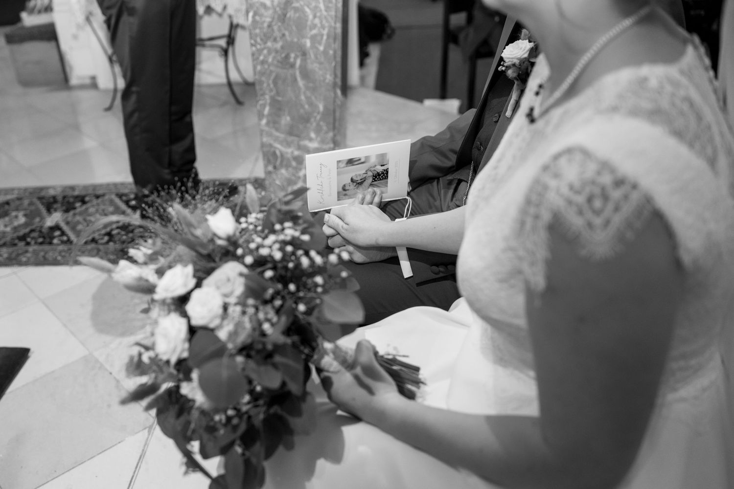 Close-up details of wedding preparation with floral arrangements and accessories.