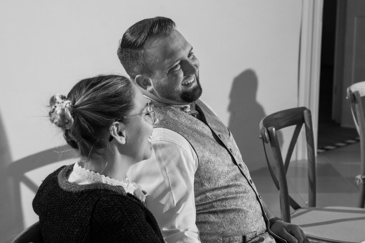 Black and white candid shots of wedding reception celebrations.