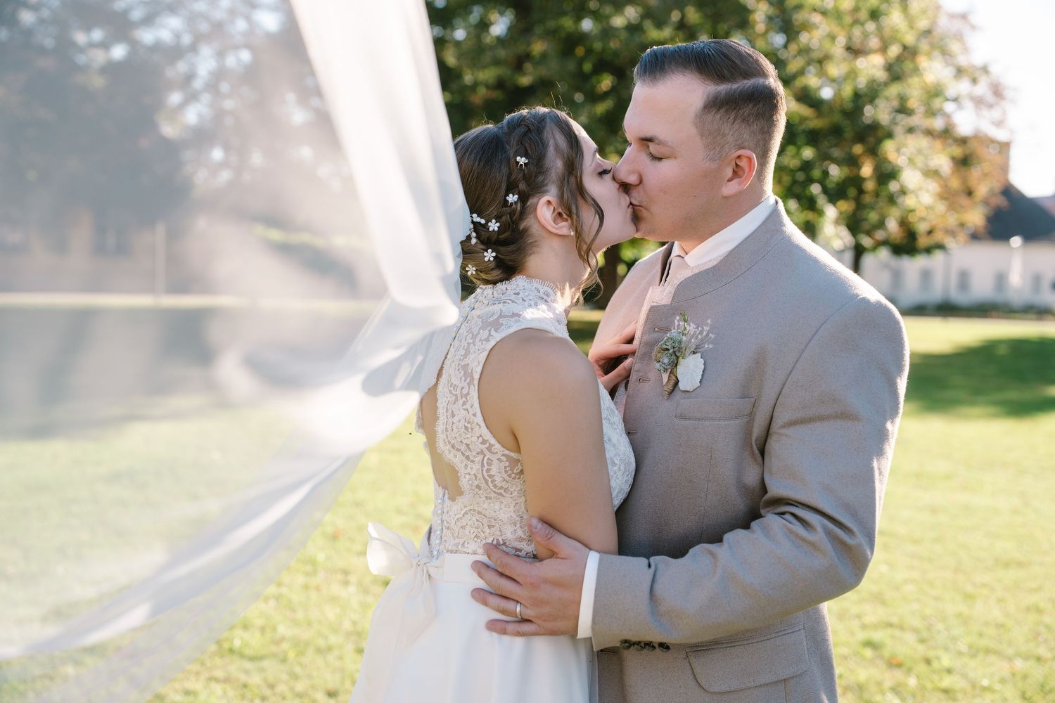 Romantic sunset wedding portraits captured in a garden setting.