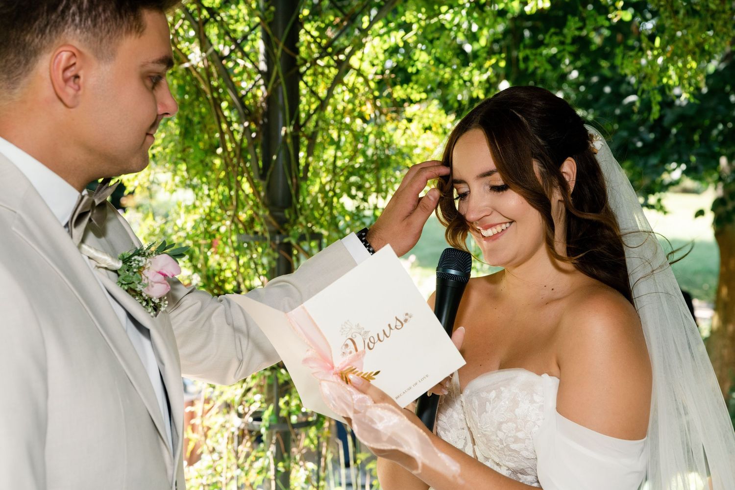 A romantic wedding moment captured in a sunlit garden setting.