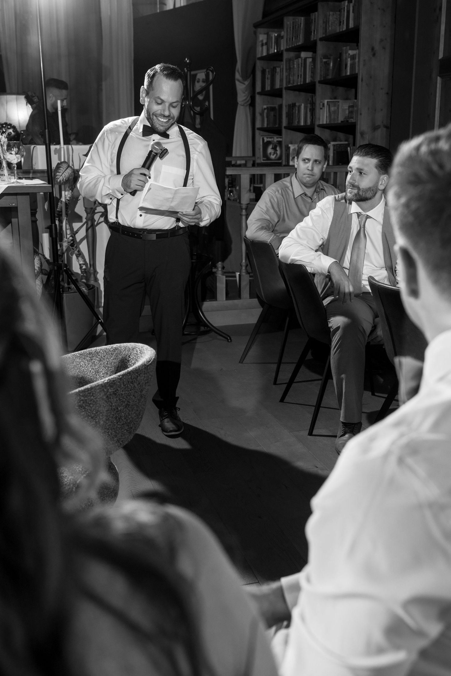 Black and white photos showing guests dancing energetically at a wedding reception.