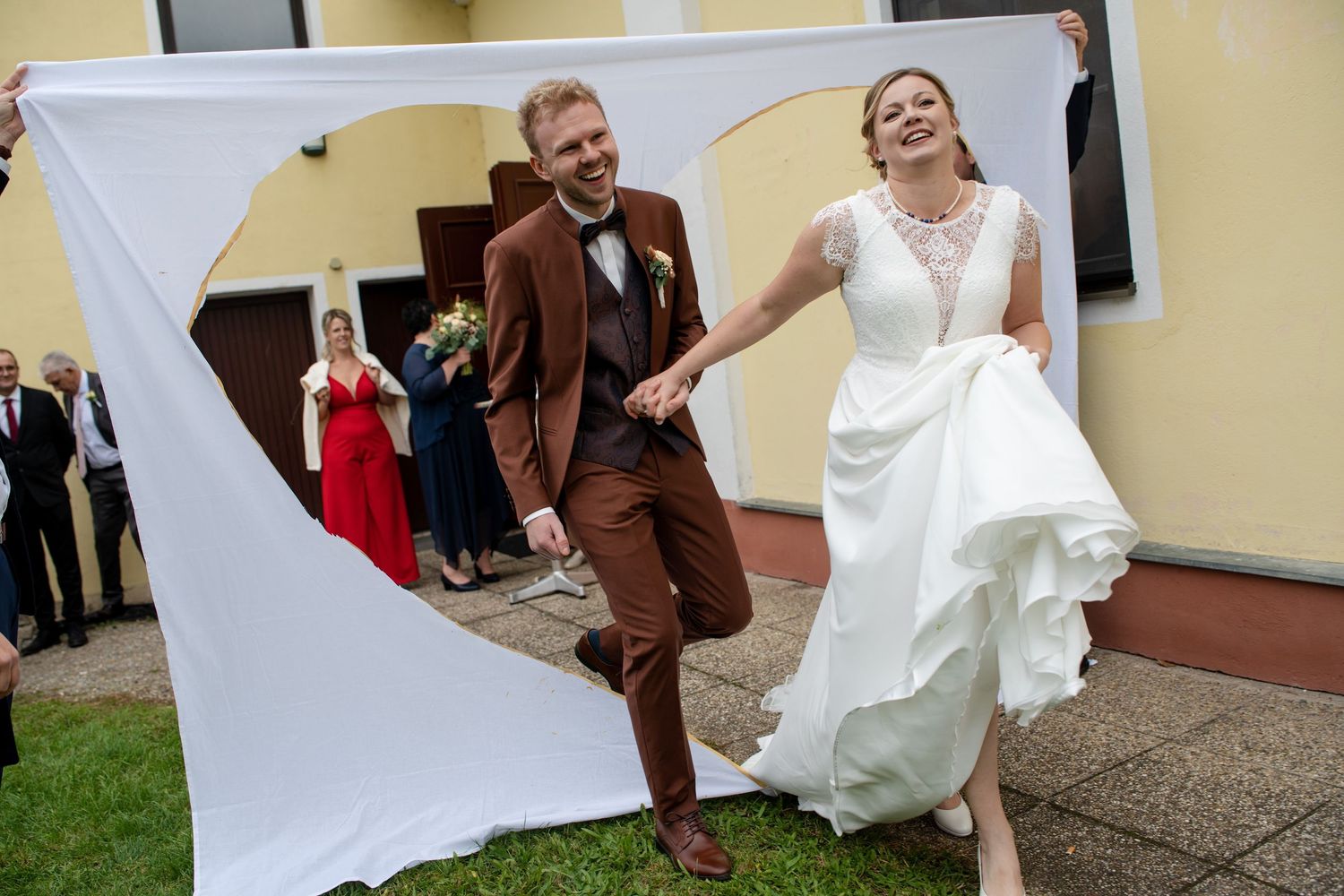 A series of playful wedding photos showing the couple dancing and embracing outdoors.