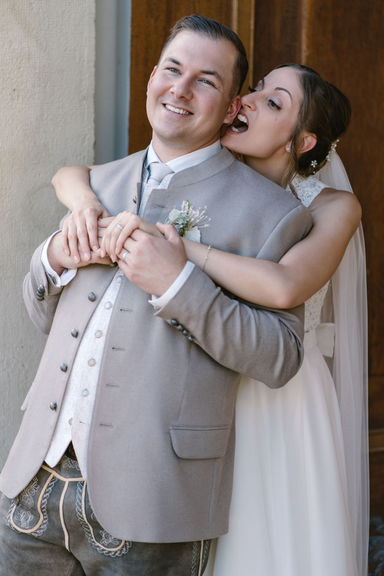 Candid sequence of newlyweds embracing and laughing together in formal wedding attire.