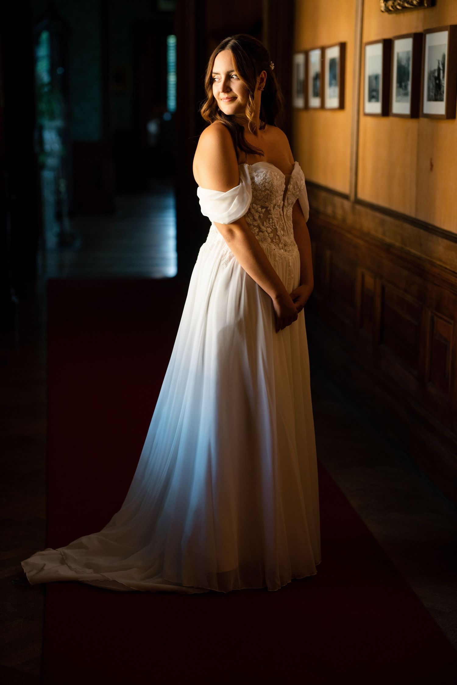 Wedding portraits in a bright white room with elegant tile flooring.