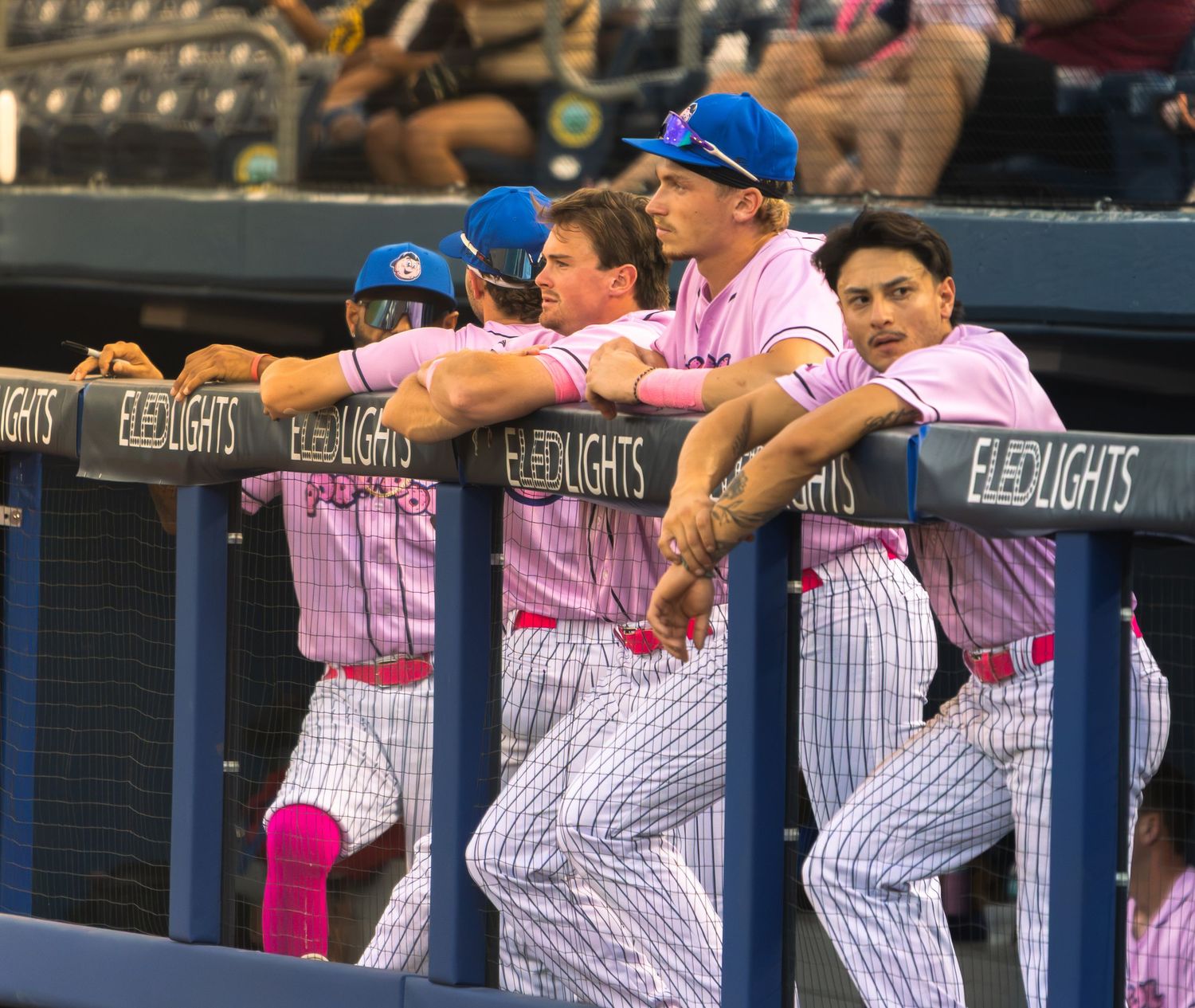 players chatting in dugout
