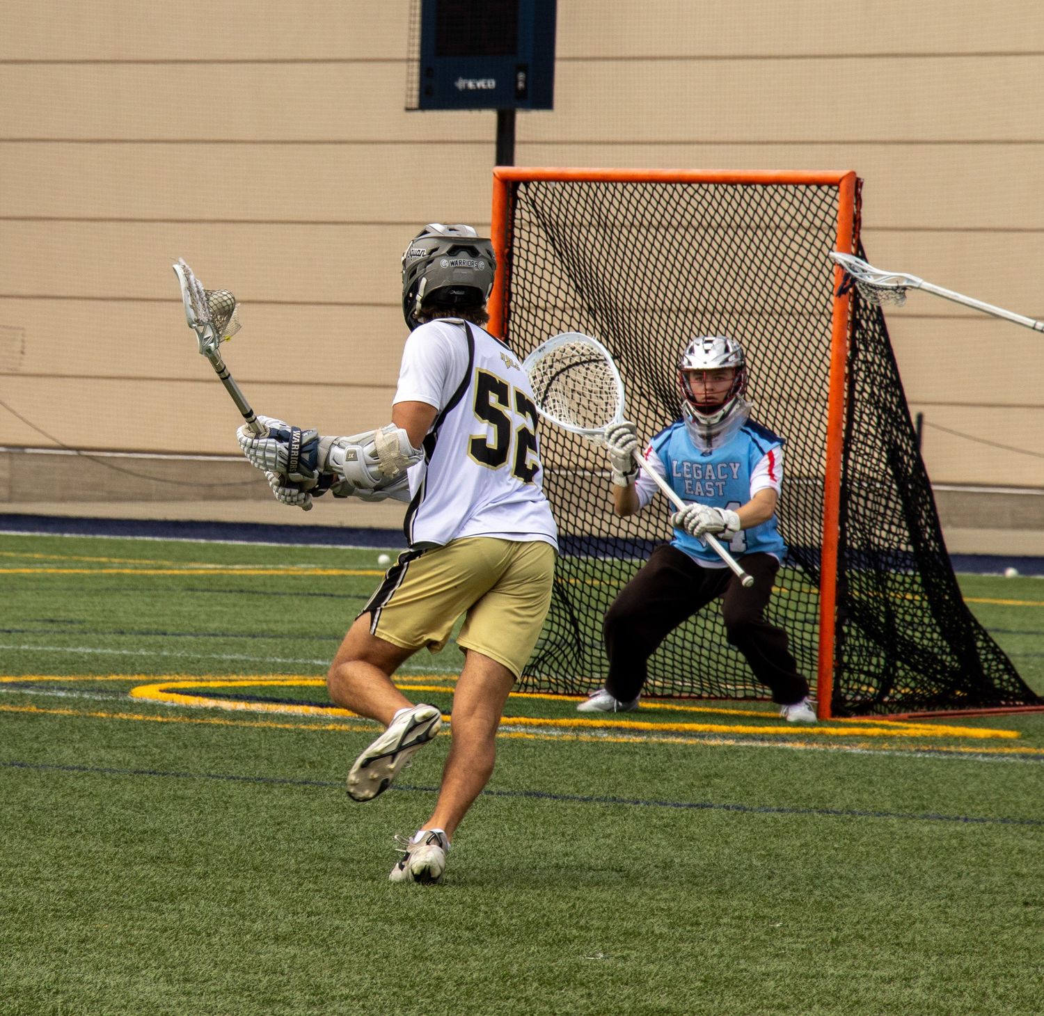 lacrosse player shotting on goal