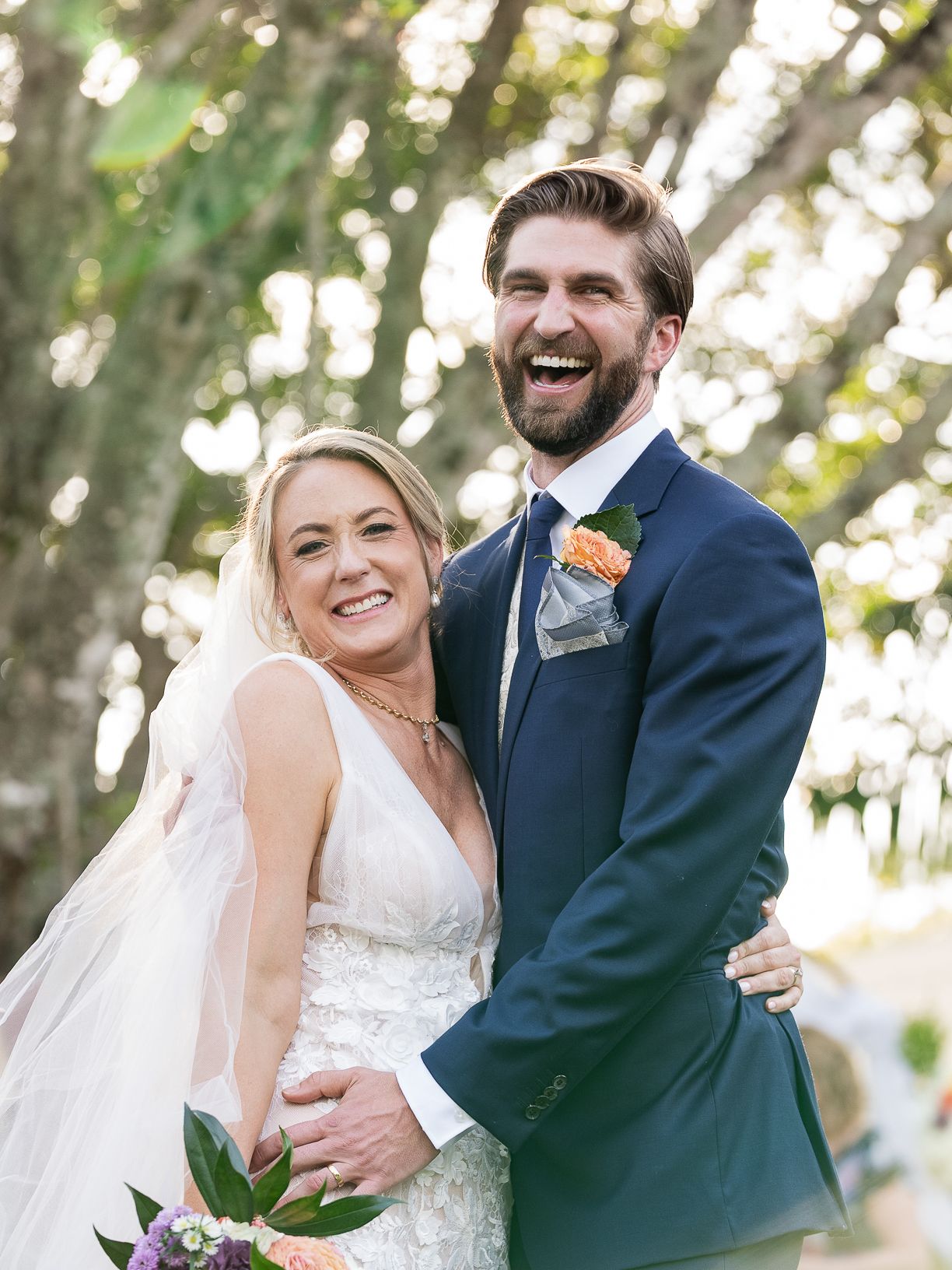 Joyful wedding couple embraces outdoors with natural greenery, Stuart, FL-Treasure Coast wedding photographer Visuals by Lizz