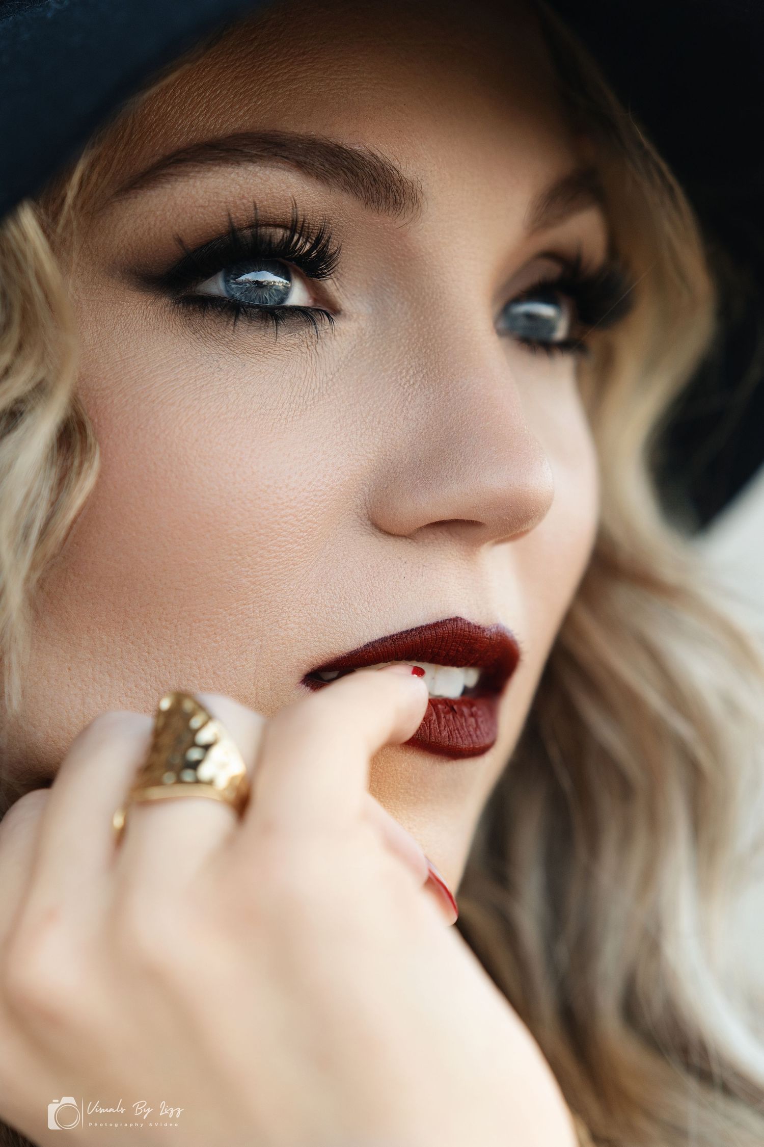 Close-up beauty shots showing dramatic red lipstick, winged eyeliner, and blonde waves in artistic portrait series.