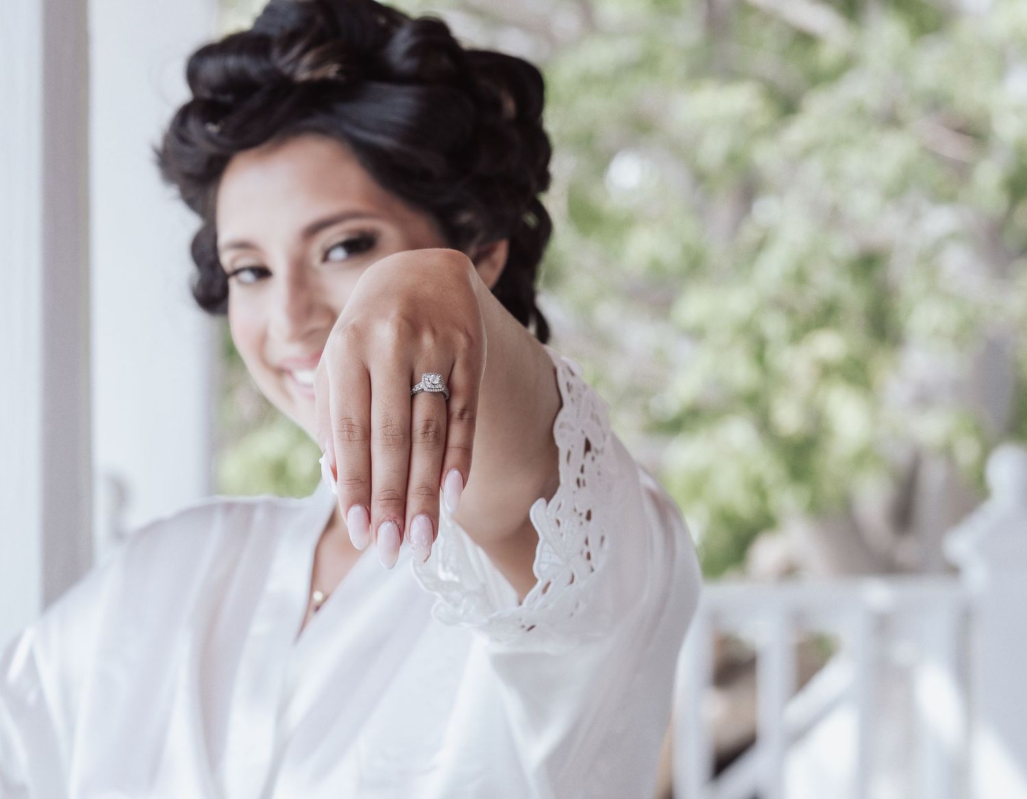 Wedding day preparation showing engagement ring and elegant styling.