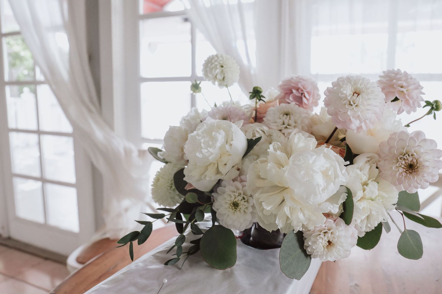 Bridal bouquet with white peonies at Fish Company venue, Islamorada FL — Visuals by Lizz, Treasure Coast wedding photographer