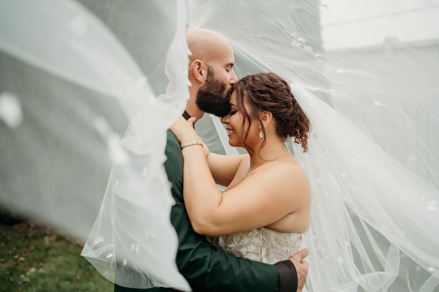 Lawrence Kansas wedding photographer capturing bride and groom walking together