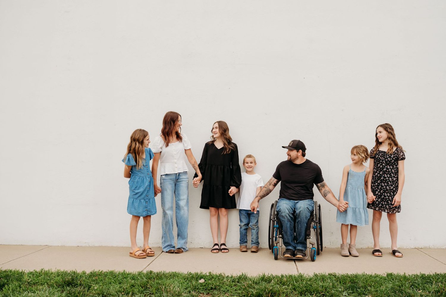 Family laughing together during Lawrence Kansas family photography session