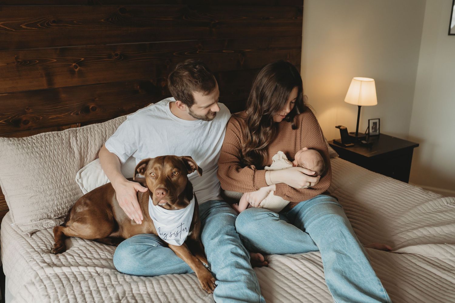 Lawrence Kansas newborn photographer capturing baby wrapped in blanket