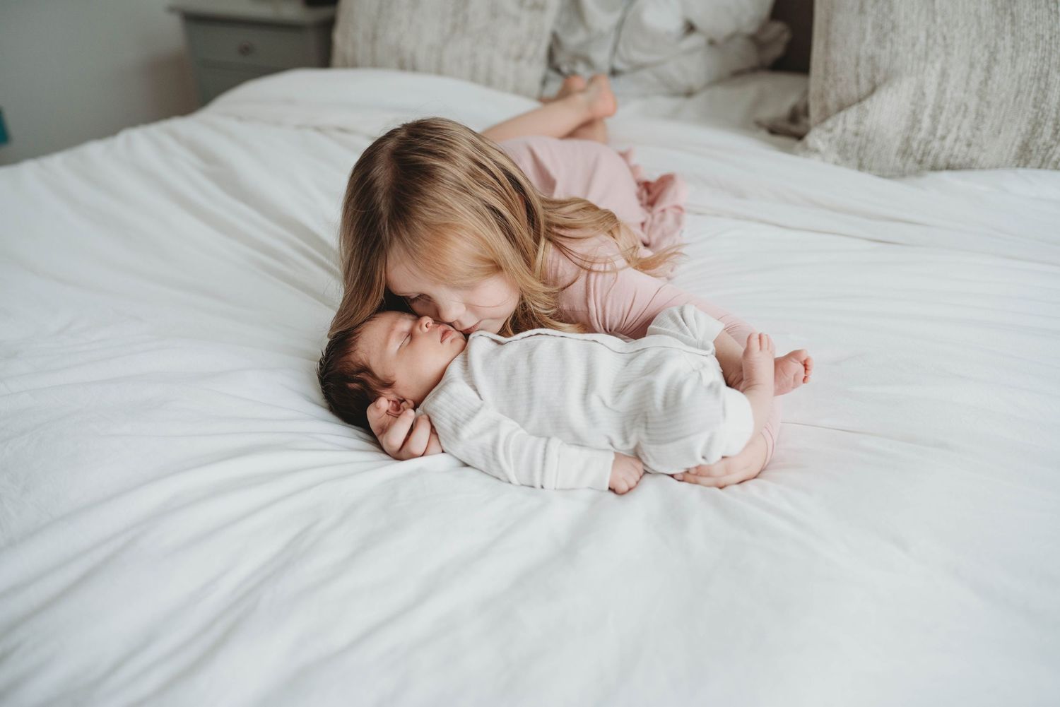 Lawrence Kansas newborn photographer capturing baby wrapped in blanket