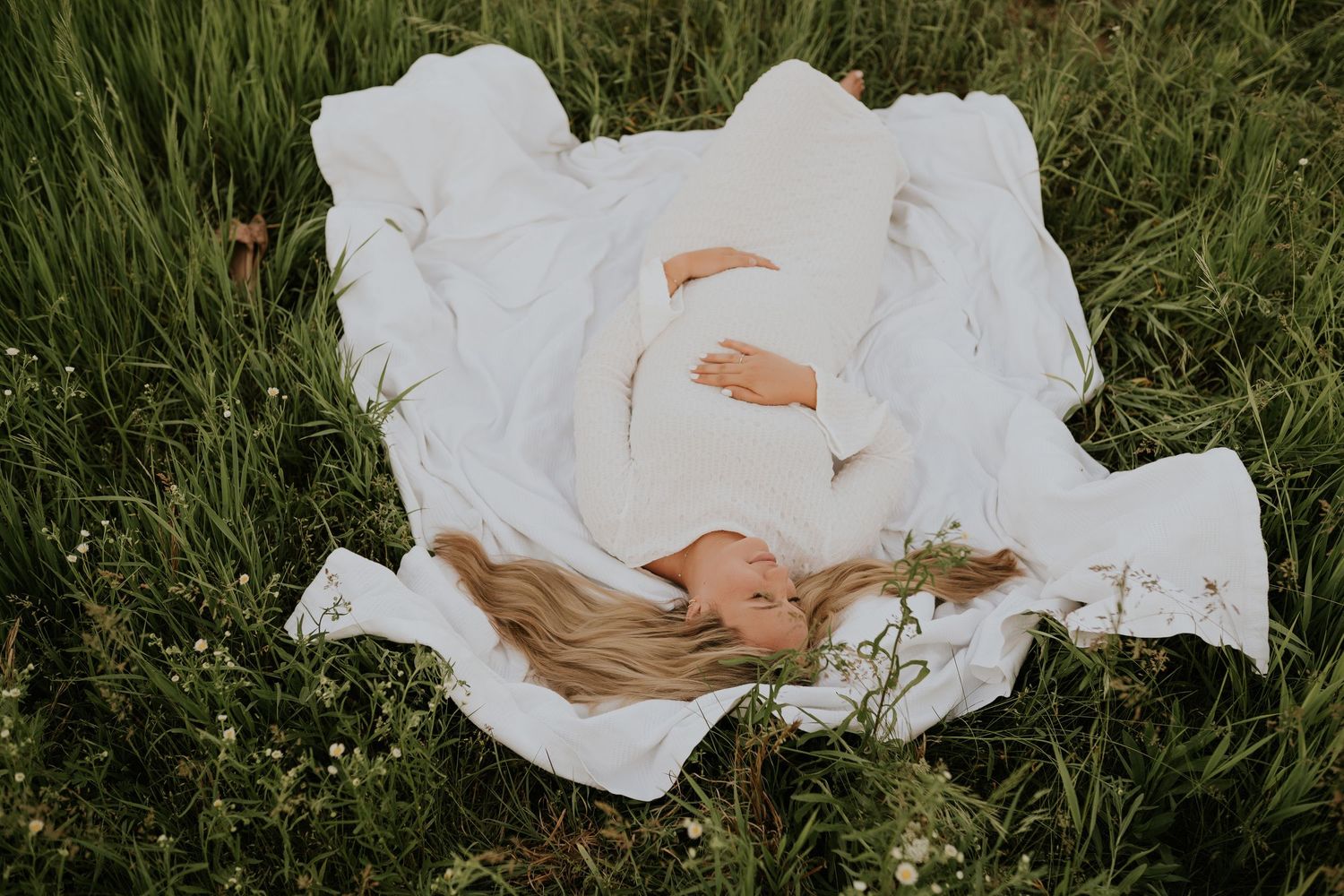 Maternity photography session capturing expecting mother in soft natural light