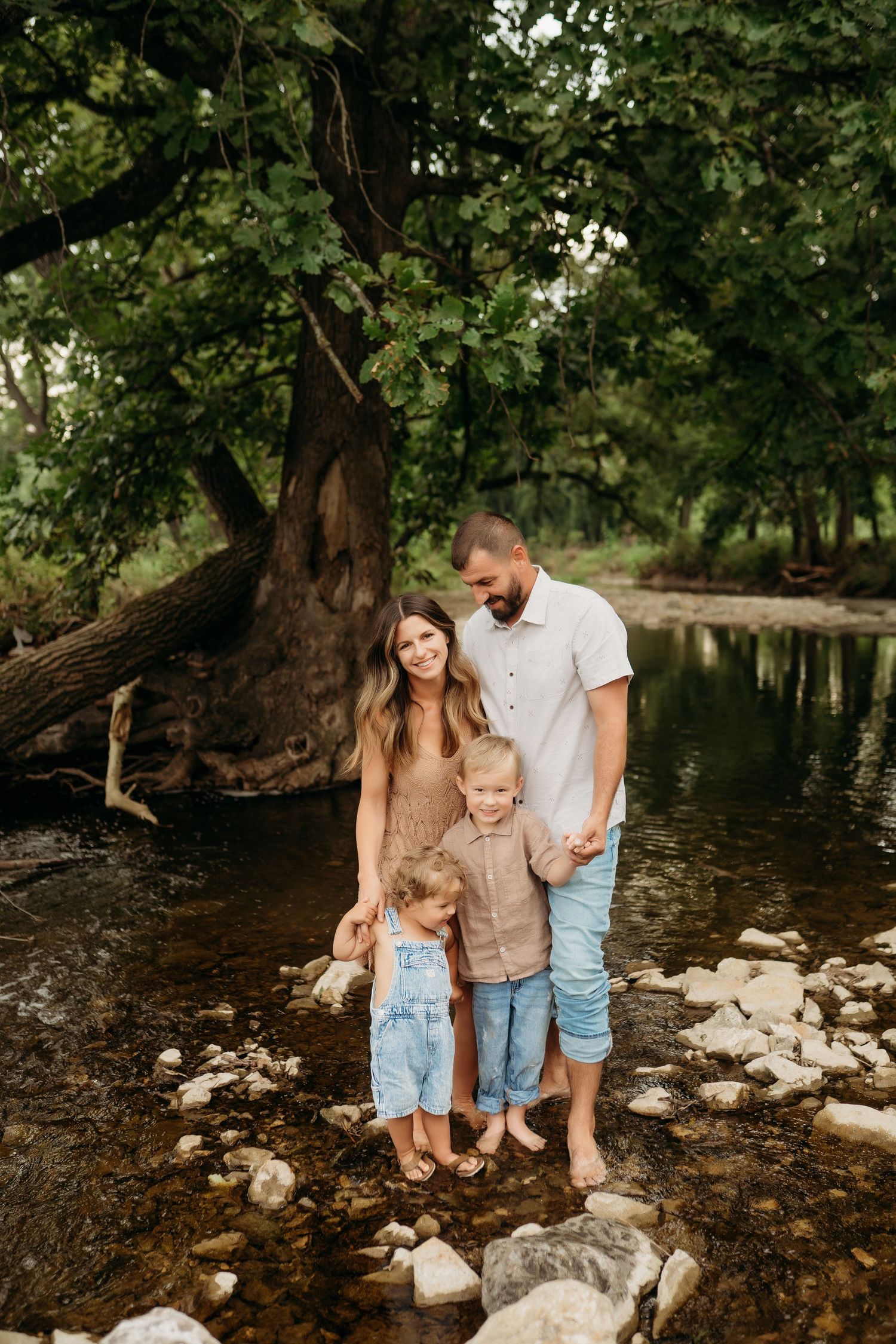Family laughing together during Lawrence Kansas family photography session