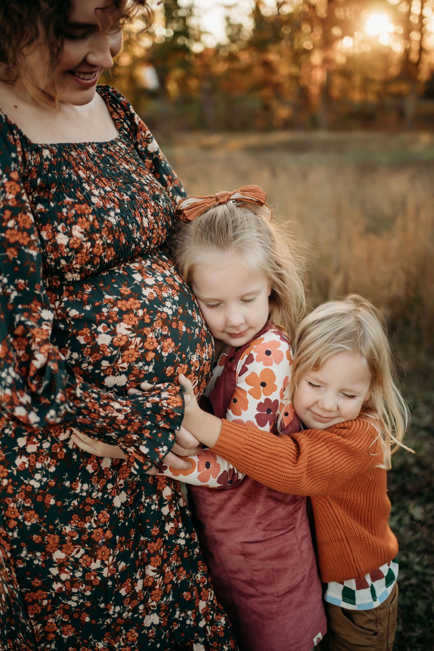 Family laughing together during Lawrence Kansas family photography session