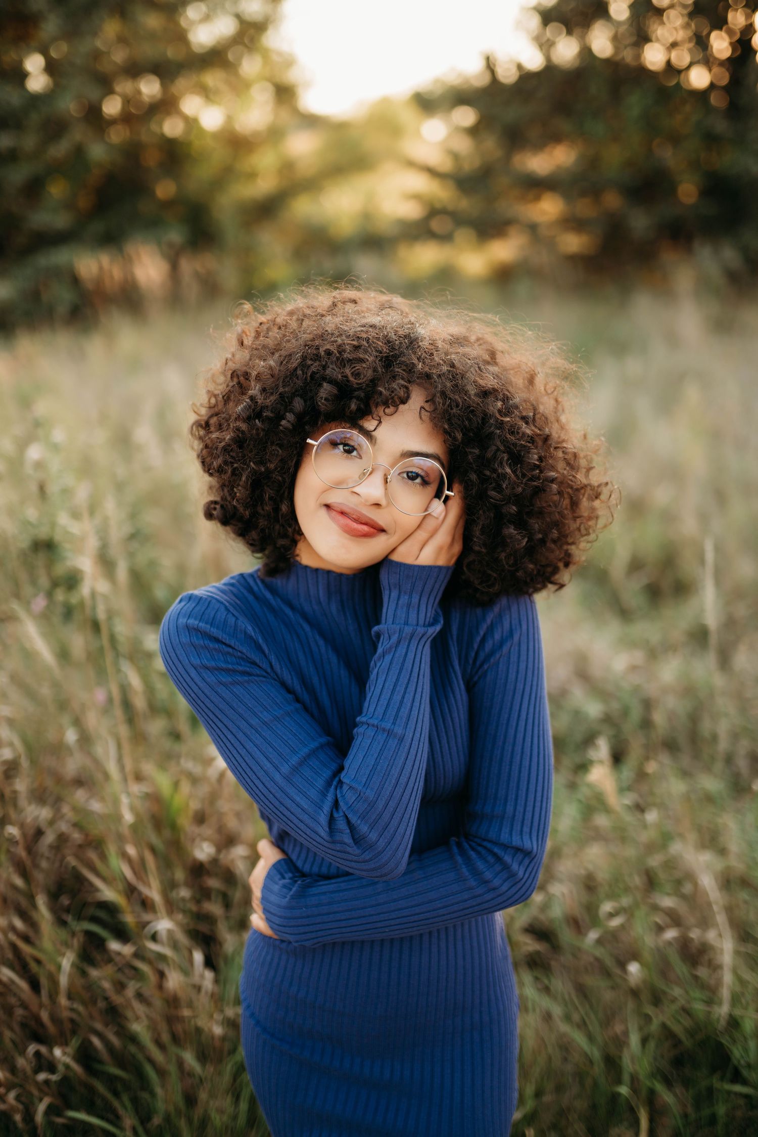 Natural portrait session of woman smiling in golden hour light