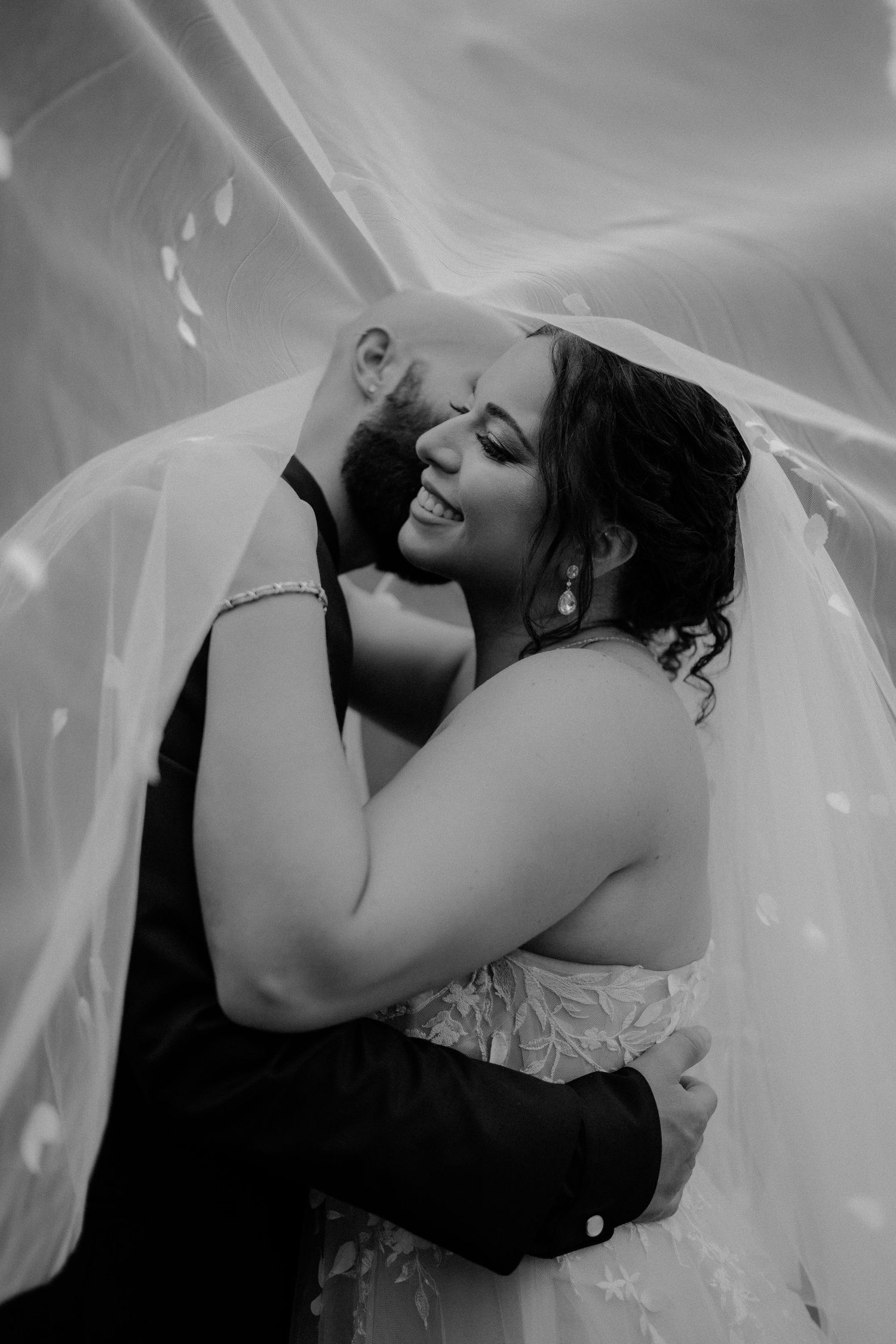 Lawrence Kansas wedding photographer capturing bride and groom walking together